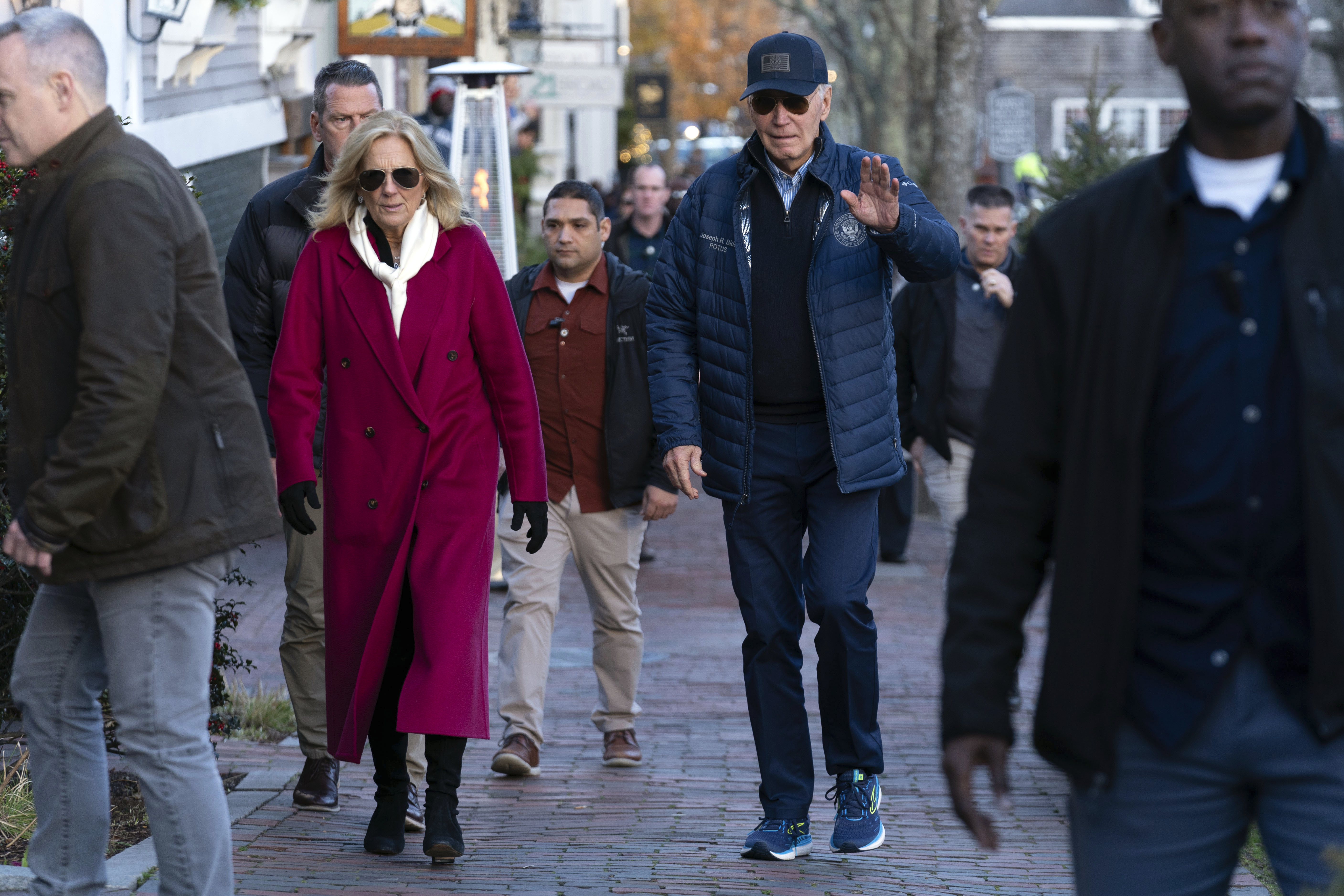 President Joe Biden, right, and first lady Jill Biden walk in downtown Nantucket, Mass., Friday, Nov. 29, 2024. (AP Photo/Jose Luis Magana)