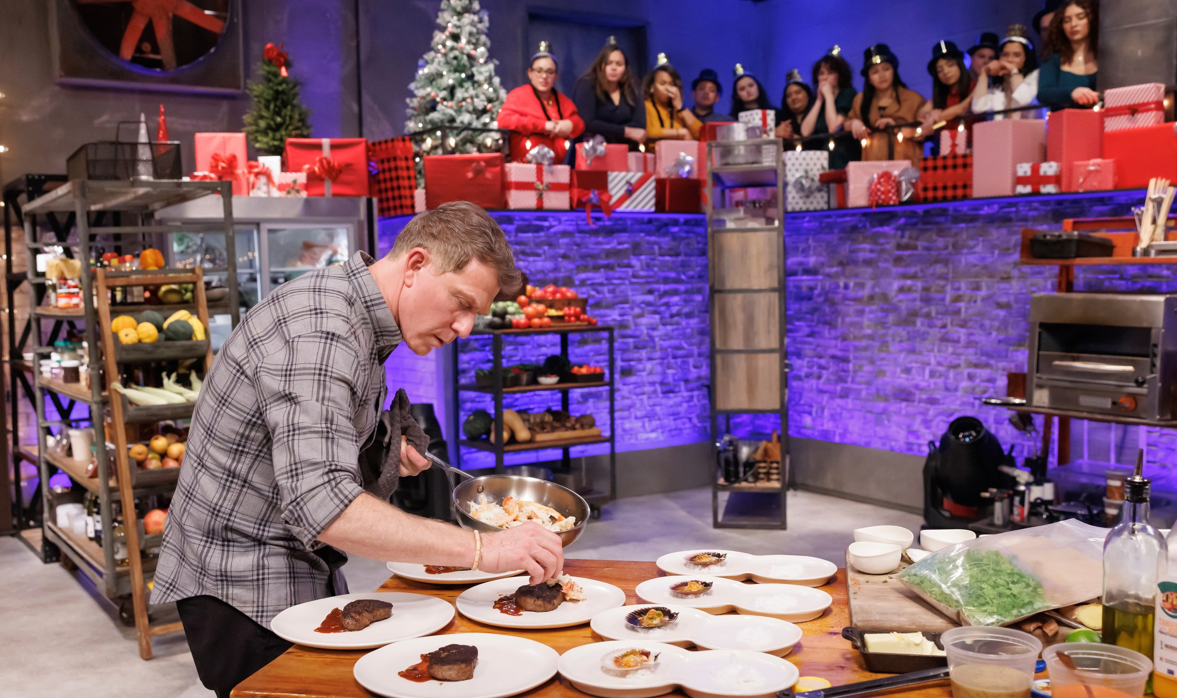 This image released by The Food Network shows Bobby Flay during an episode of the cooking series "Beat Bobby Flay: Holiday Throwdown." (Stephen Davis Phillips/Food Network via AP)