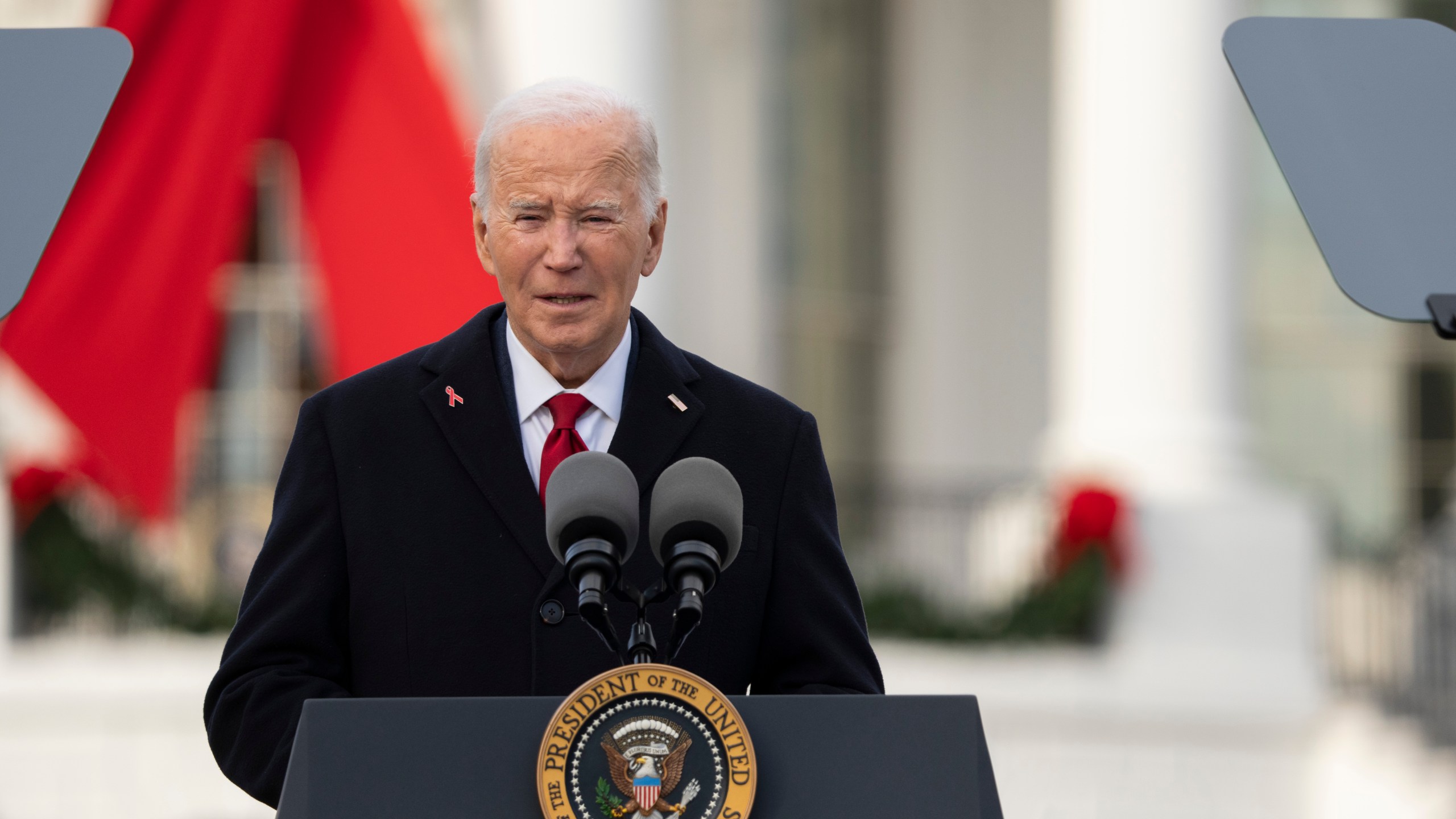 President Joe Biden speaks on the South Lawn of the White House during a ceremony to commemorate World AIDS Day with survivors, their families and advocates, Sunday, Dec. 1, 2024, in Washington. (AP Photo/Manuel Balce Ceneta)