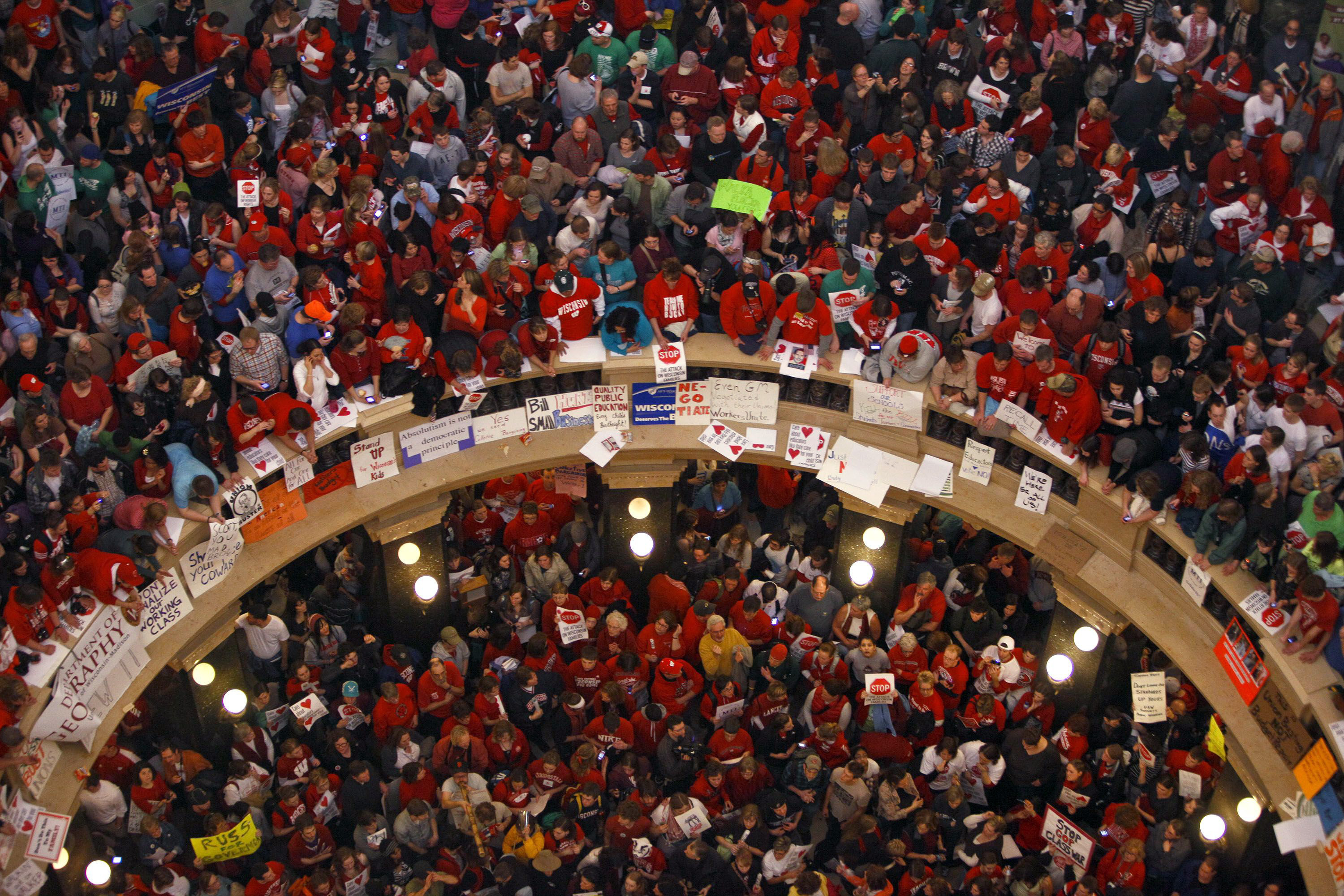 FILE - This file photo taken Feb. 17, 2011 shows protestors of Wisconsin Gov. Scott Walker's bill to eliminate collective bargaining rights for many state workers packing the rotunda at the State Capitol in Madison, Wis. (AP Photo/Andy Manis, File)