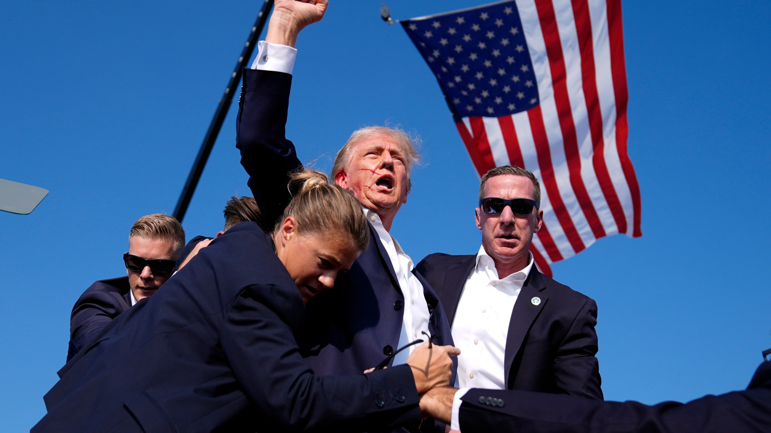 Republican presidential candidate former President Donald Trump is surrounded by U.S. Secret Service agents at a campaign rally, Saturday, July 13, 2024, in Butler, Pa. (AP Photo/Evan Vucci)