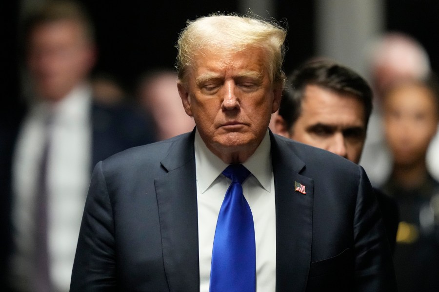 FILE - Former President Donald Trump walks to make comments to members of the media after a jury convicted him of felony crimes for falsifying business records in a scheme to illegally influence the 2016 election, at Manhattan Criminal Court, May 30, 2024, in New York. (AP Photo/Seth Wenig, Pool, File)