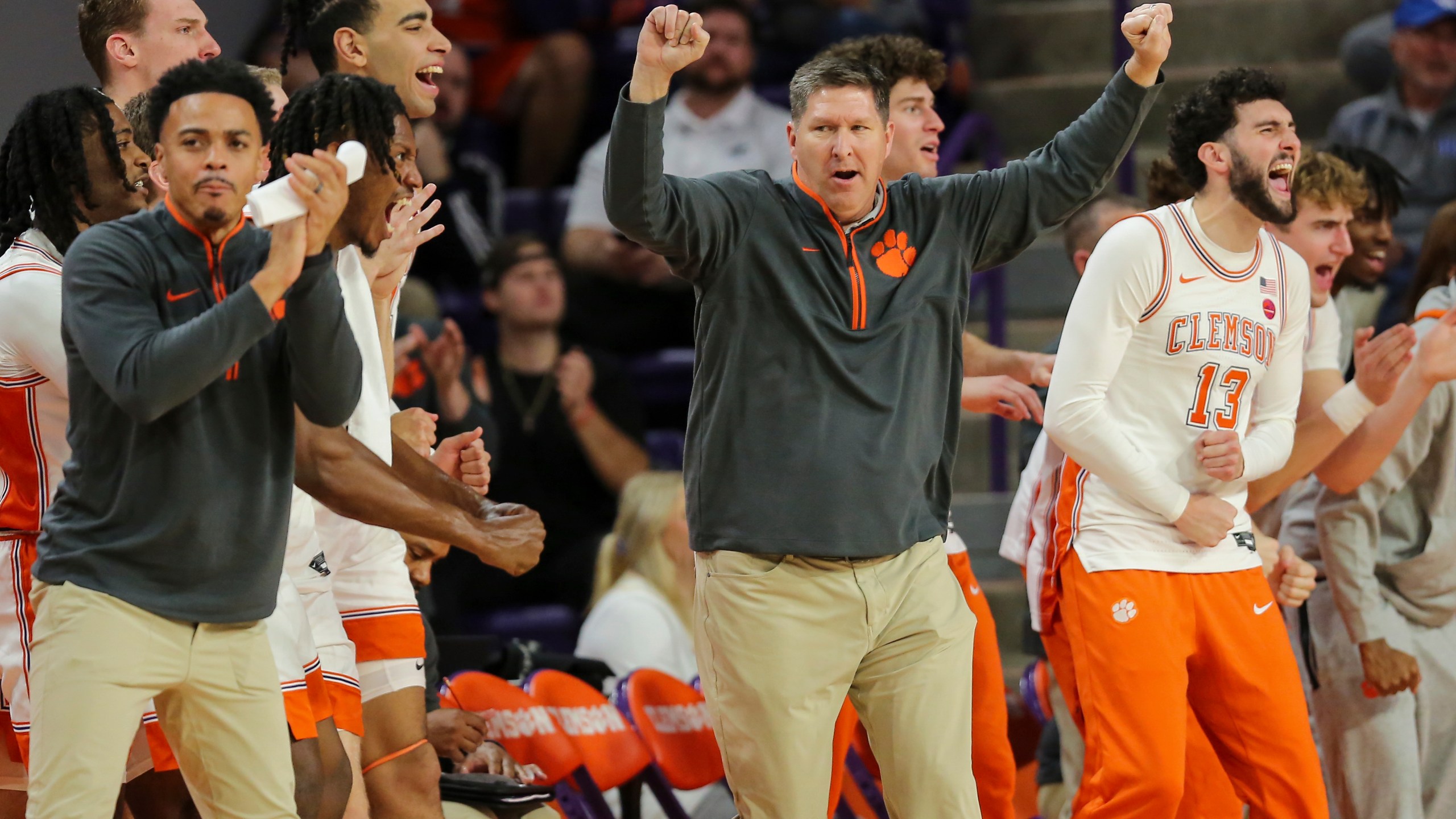 Clemson head coach Brad Brownell celebrates an offensive foul by Kentucky during the first half of an NCAA college basketball game Tuesday, Dec. 3, 2024, in Clemson, S.C. (AP Photo/Artie Walker Jr.)