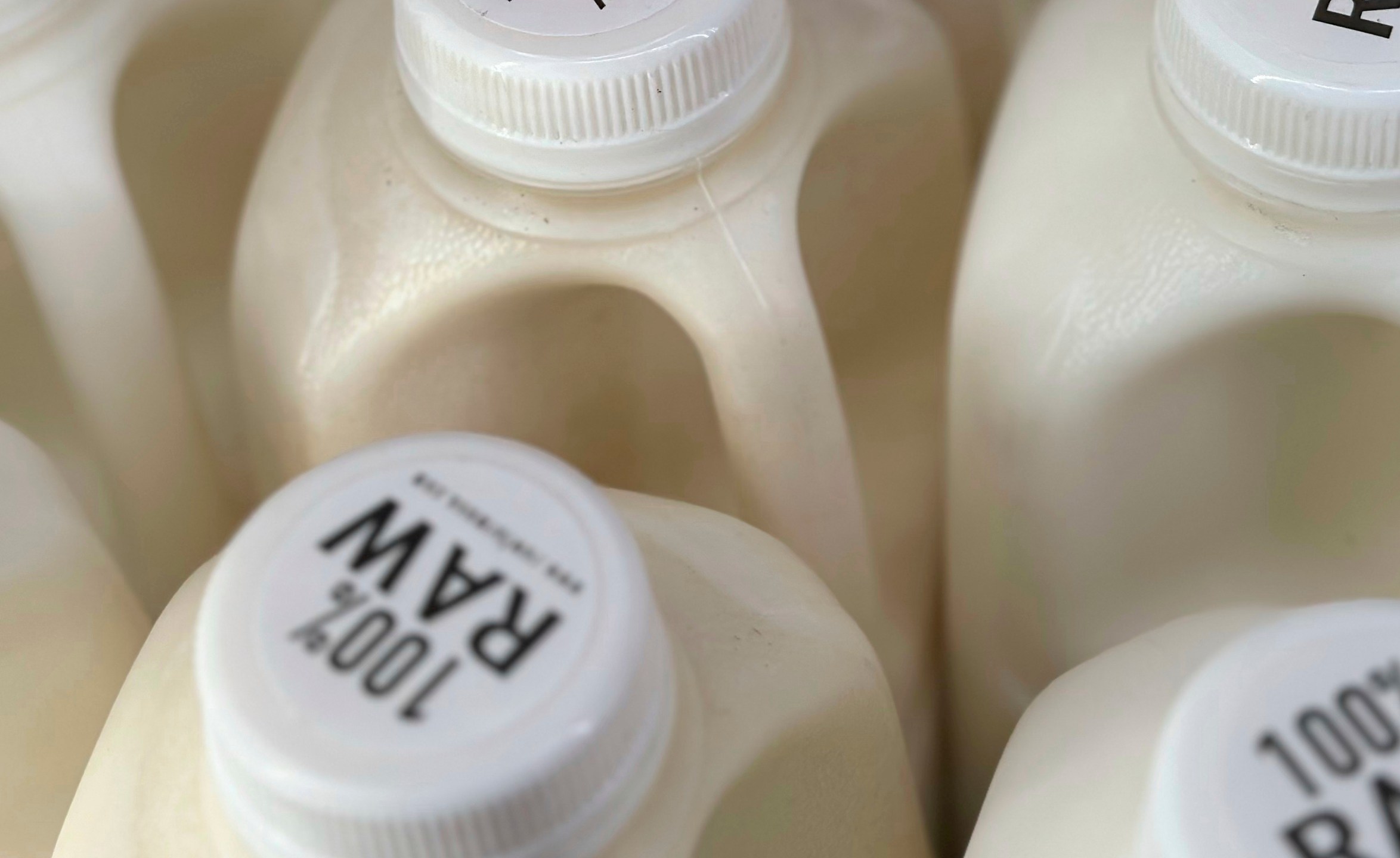 FILE - Bottles of raw milk are displayed for sale at a store in Temecula, Calif., on Wednesday, May 8, 2024. (AP Photo/JoNel Aleccia, file)