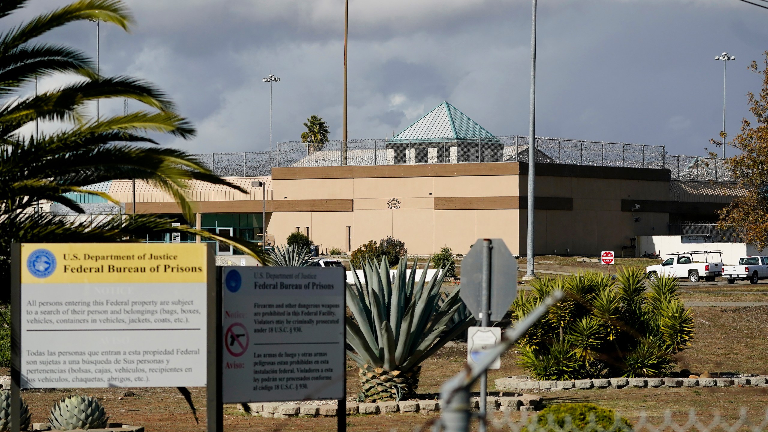 FILE - The Federal Correctional Institution stands in Dublin, Calif., Dec. 5, 2022. The federal Bureau of Prisons is permanently closing its “rape club” women’s prison in California and will idle six other facilities in a sweeping realignment after years of abuse, decay and mismanagement, the Associated Press has learned. (AP Photo/Jeff Chiu, File)