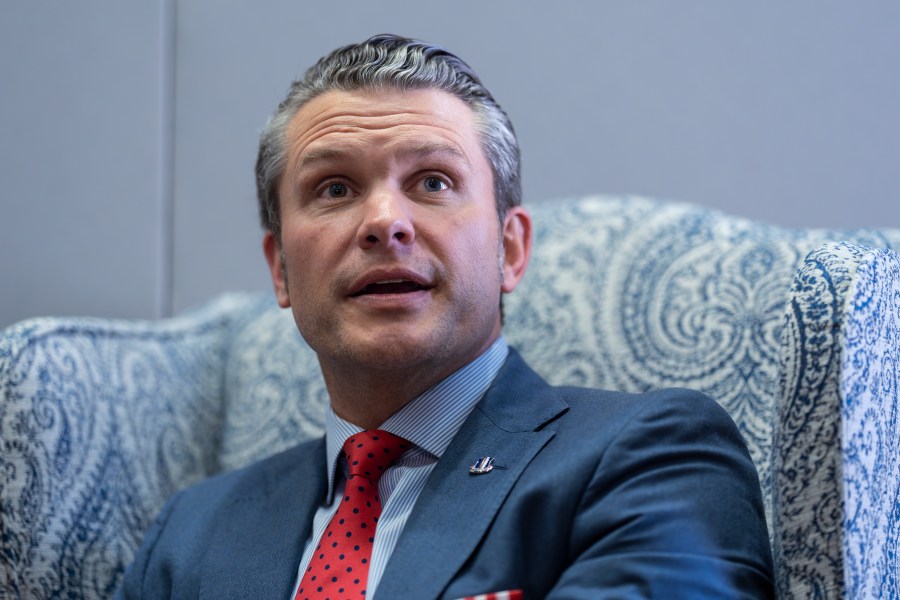 Pete Hegseth, President-elect Donald Trump's nominee to be defense secretary, responds to reporters during a meeting with Sen. Mike Rounds, R-S.D., a member of the Senate Armed Services Committee, at the Capitol in Washington, Thursday, Dec. 5, 2024. (AP Photo/J. Scott Applewhite)