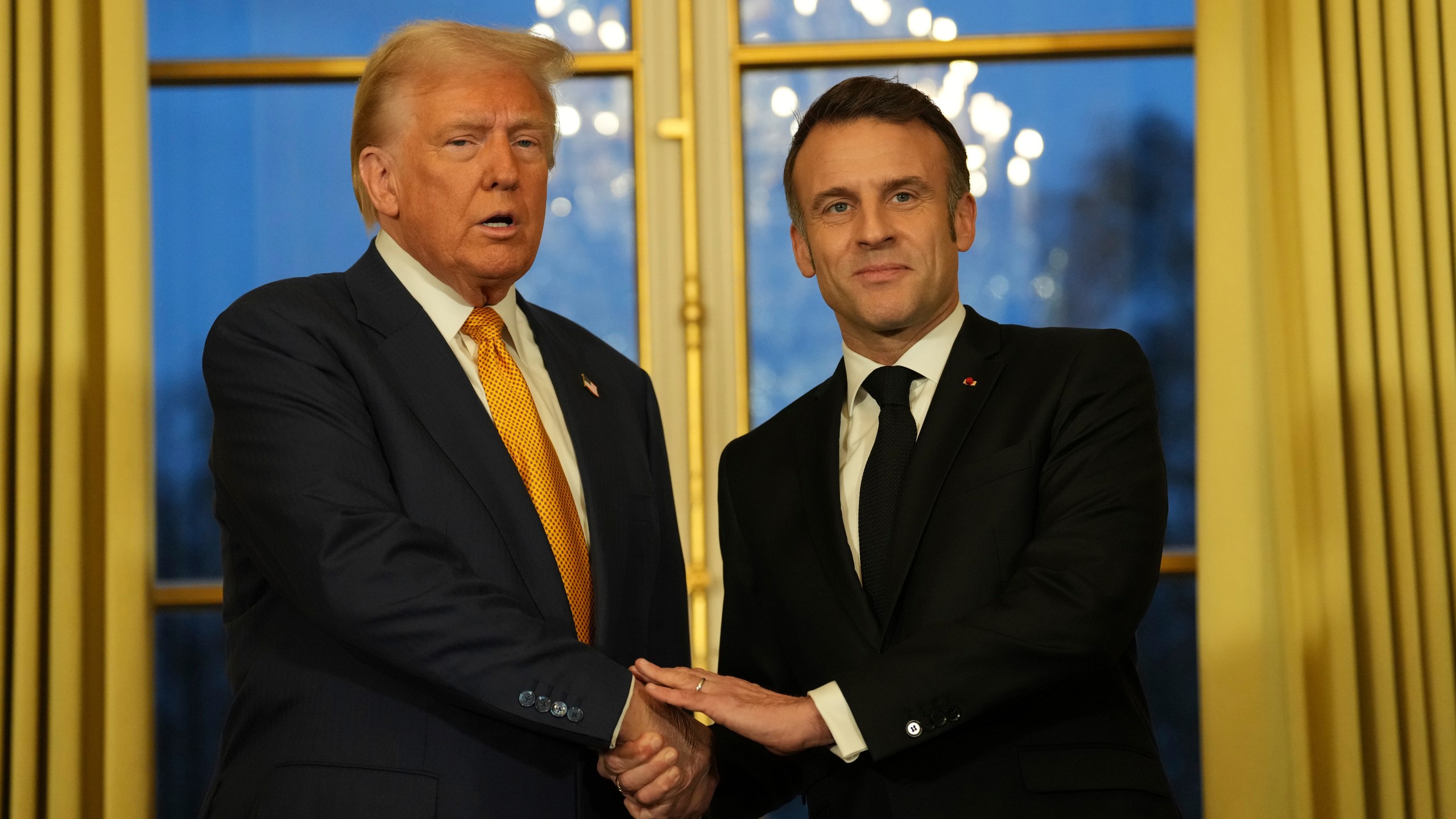 French President Emmanuel Macron, right, shakes hands with President-elect Donald Trump at the Elysee Palace, Saturday, Dec. 7, 2024 in Paris. (AP Photo/Aurelien Morissard)