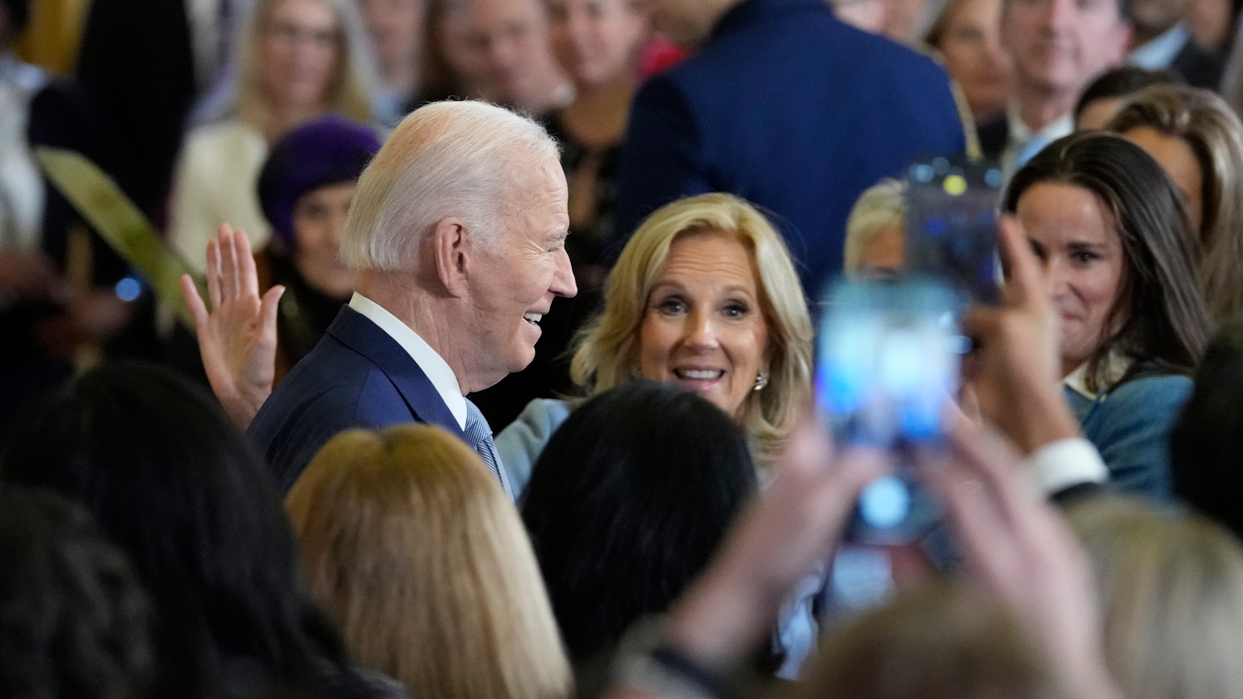 President Joe Biden, left, with first lady Jill Biden in the audience, center, and daughter Ashley Biden, right, walks out of the East Room of the White House after speaking at the White House Conference on Women's Health Research in Washington, Wednesday, Dec. 11, 2024. (AP Photo/Susan Walsh)