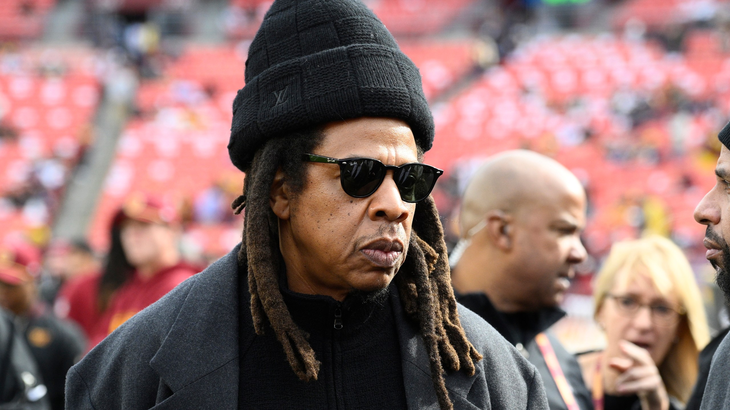 FILE - Musician Jay-Z stands on the field before an NFL football game between the Washington Commanders and Dallas Cowboys, on Nov. 24, 2024, in Landover, Md. (AP Photo/Nick Wass, File)