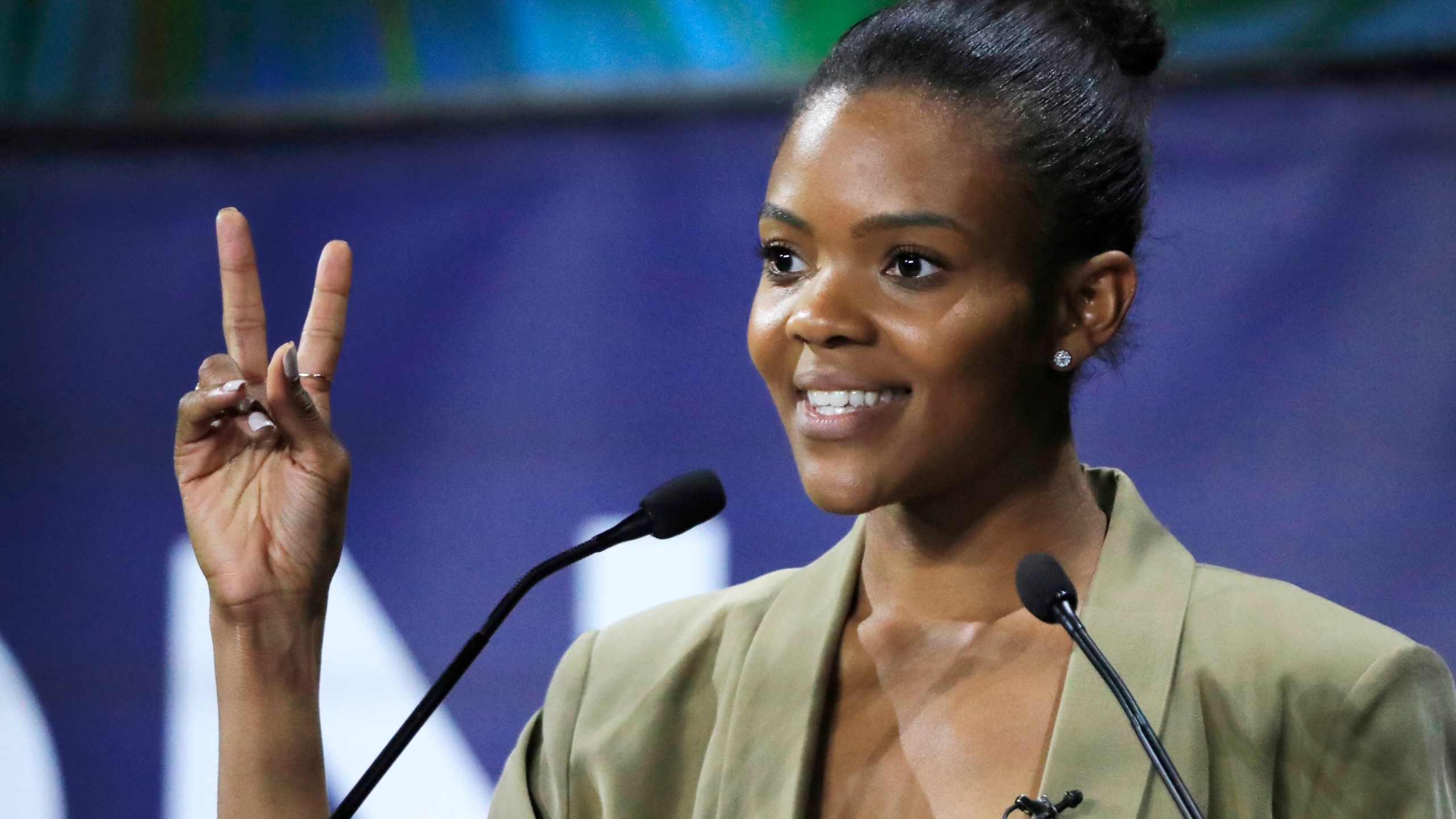 FILE - Candace Owens, director of urban engagement for Turning Point USA gestures as she speaks at the Convention of the Right, in Paris, Sept. 28, 2019. (AP Photo/Michel Euler, File)