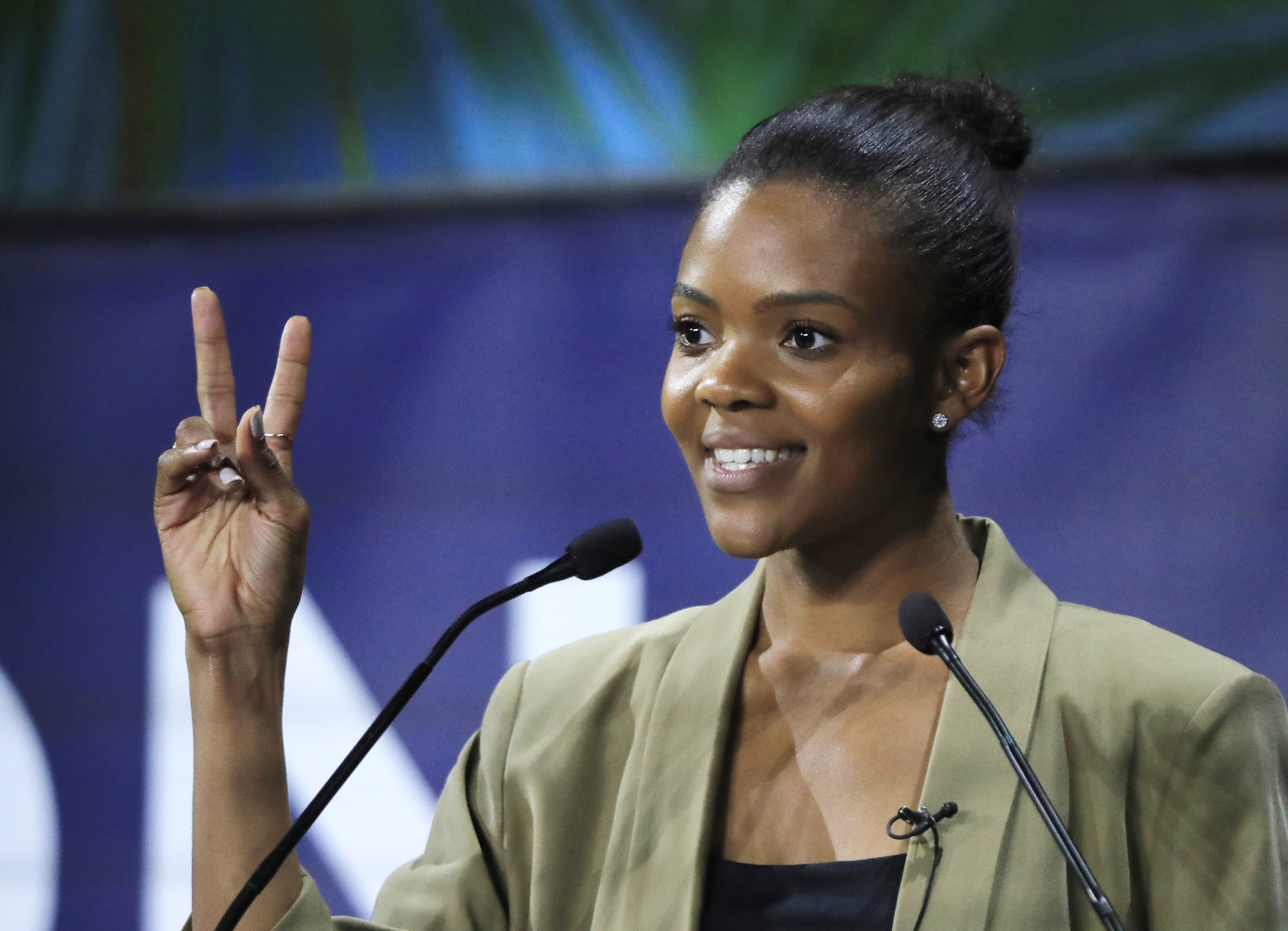 FILE - Candace Owens, director of urban engagement for Turning Point USA gestures as she speaks at the Convention of the Right, in Paris, Sept. 28, 2019. (AP Photo/Michel Euler, File)