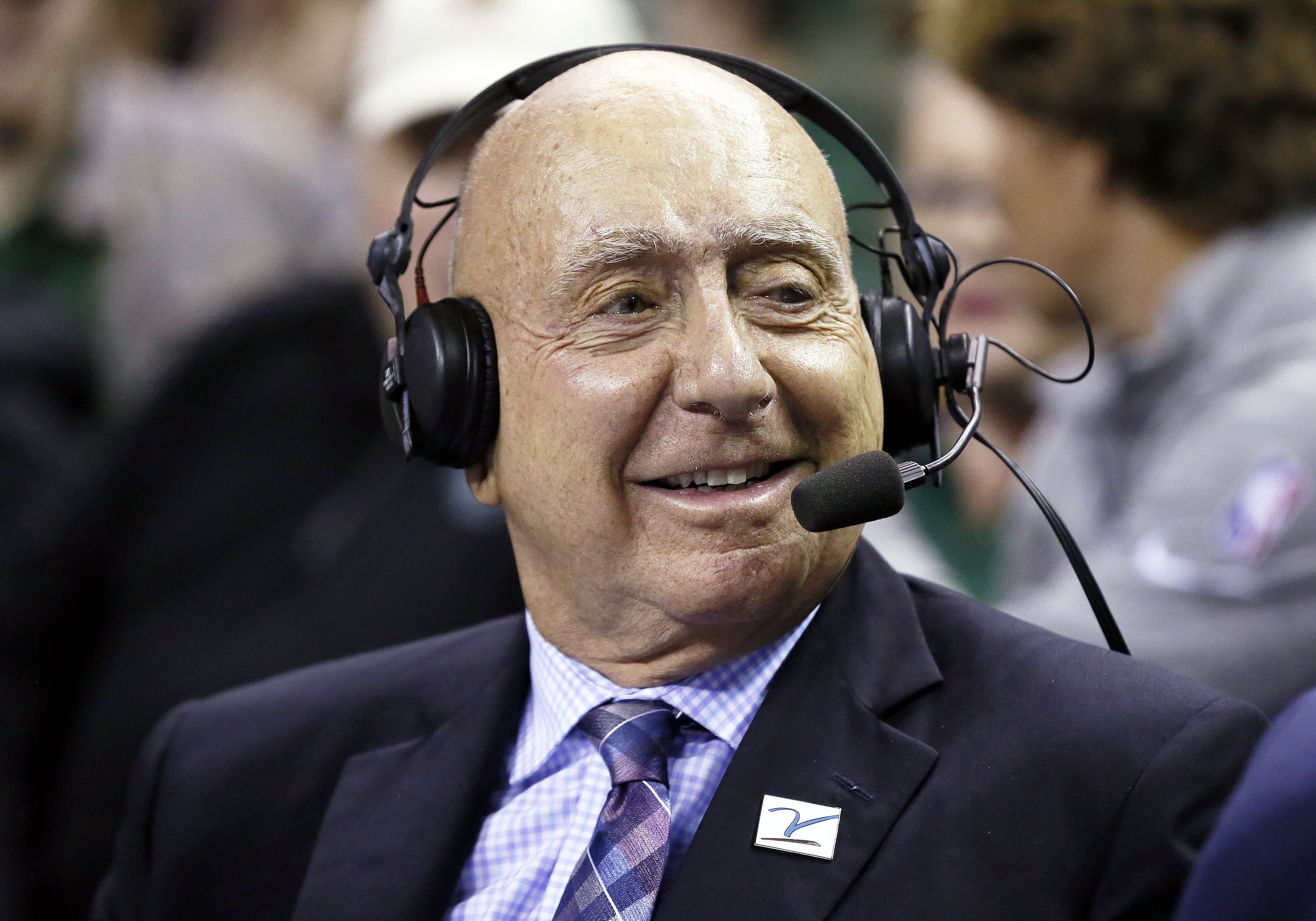 FILE - ABC/ESPN basketball analyst Dick Vitale sits at midcourt prior to an NCAA college basketball game between Baylor and Villanova, Dec. 12, 2021, in Waco, Texas. (AP Photo/Ray Carlin, File)