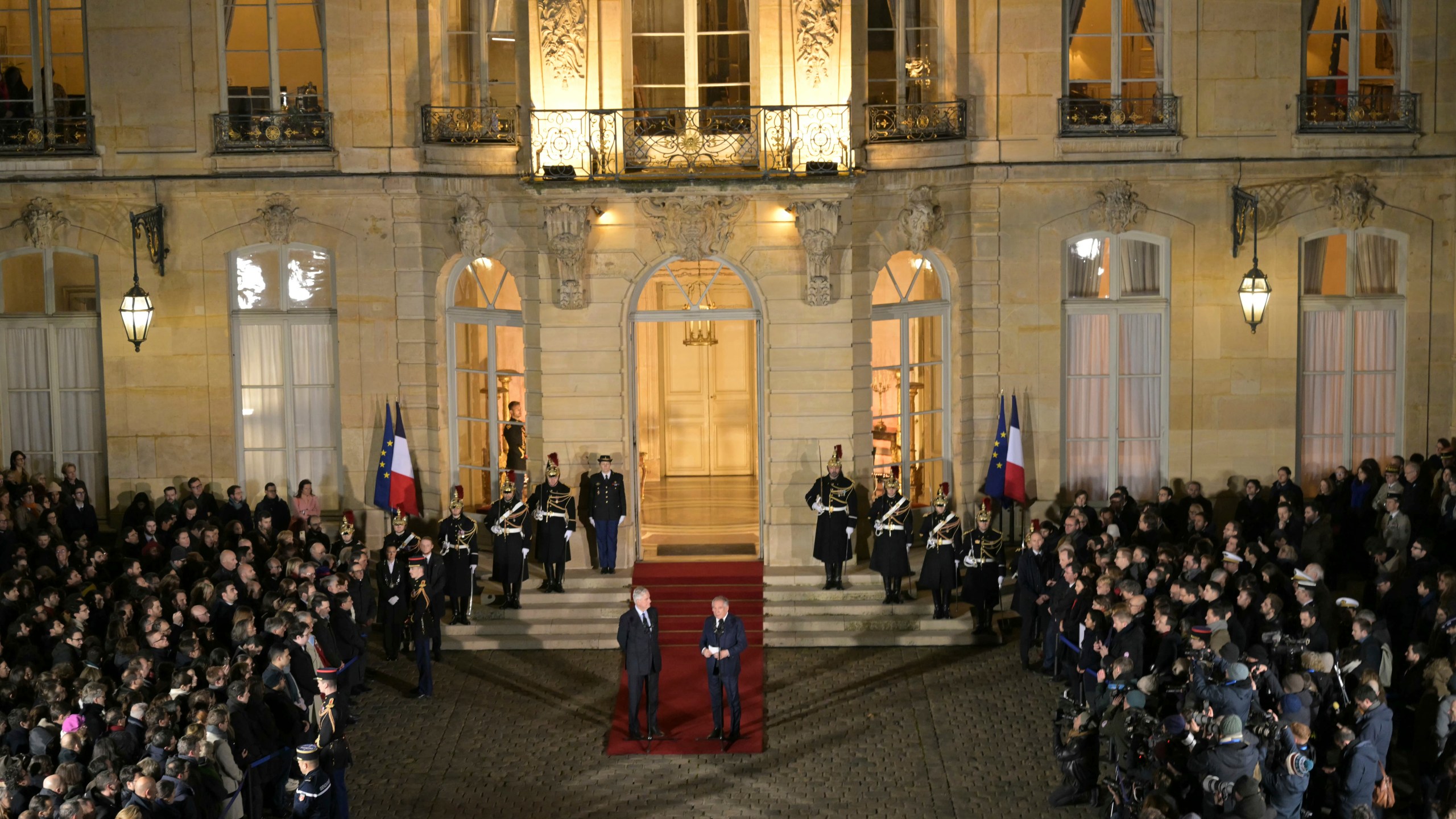 France's newly appointed Prime Minister Francois Bayrou, right, and outgoing Prime minister Michel Barnier speak after the handover ceremony at the Hotel Matignon , the Prime Minister residence, in Paris, Friday Dec. 13, 2024.( Bertrand Guay/ Pool via AP)