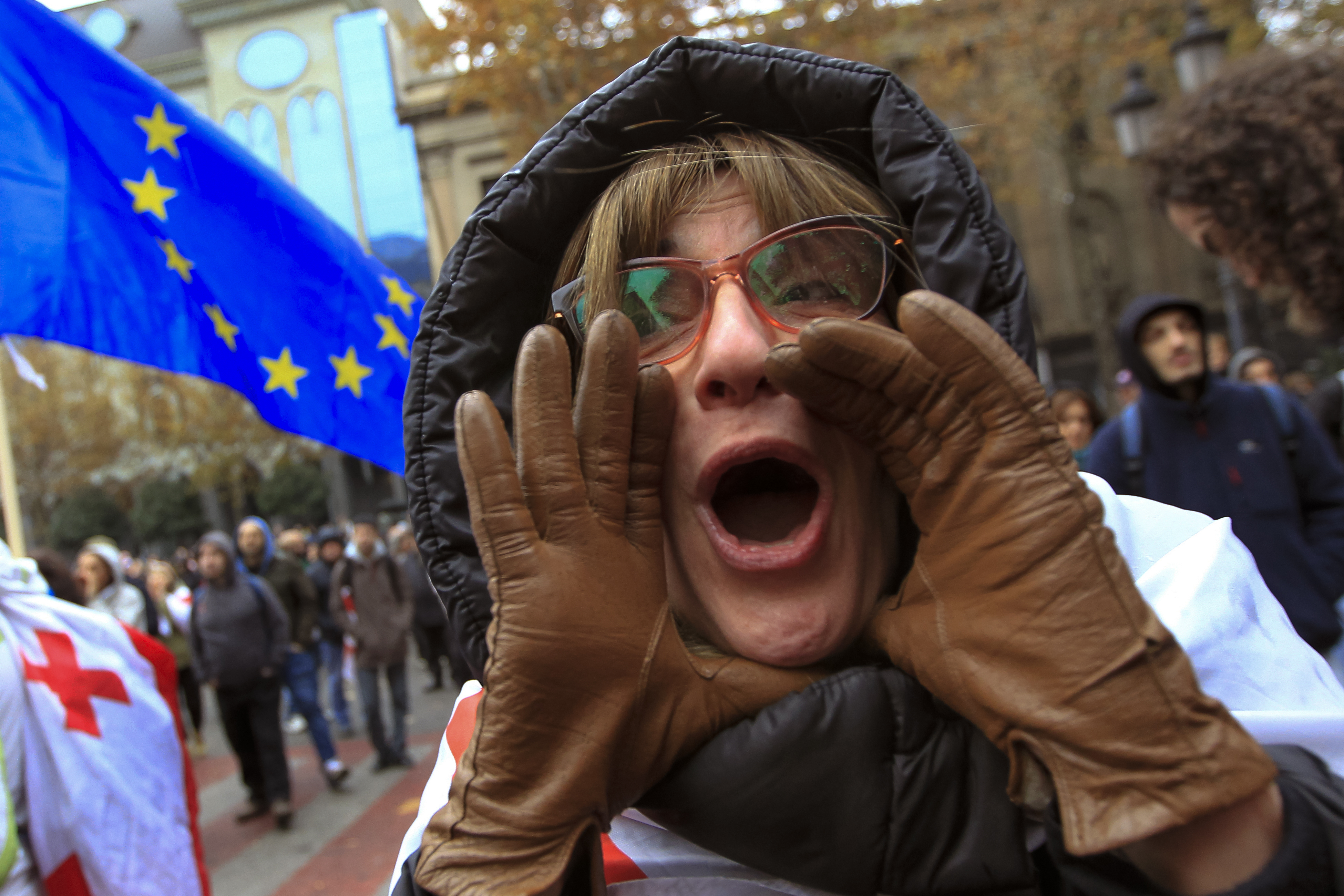 FILE - A protester shouts during a rally demanding new parliamentary elections in Tbilisi, Georgia, on Nov. 25, 2024. (AP Photo/Shakh Aivazov, File)