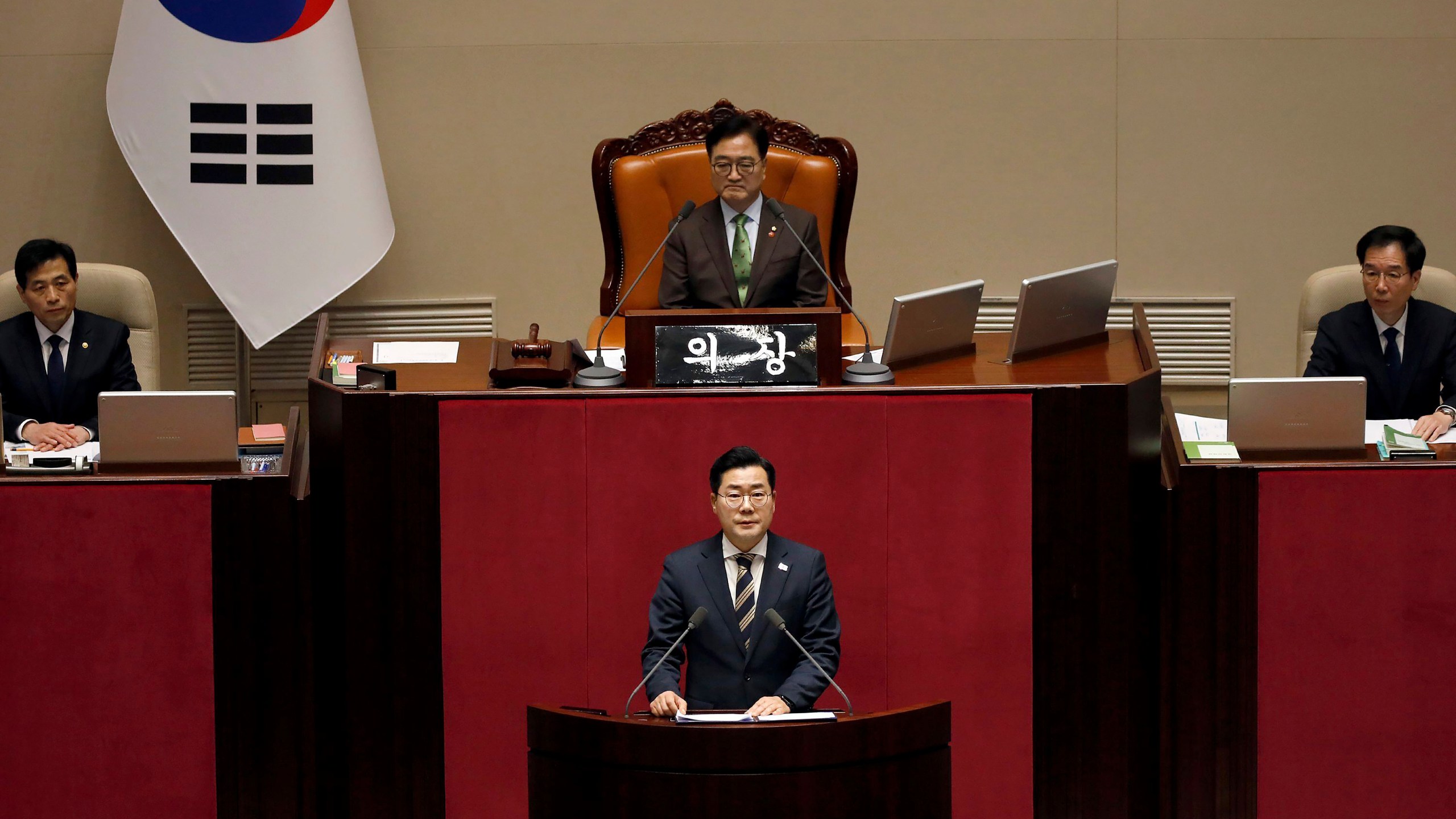 Park Chan-dae, floor leader of the Democratic Party, speaks during the plenary session for the impeachment vote of President Yoon Suk Yeol at the National Assembly in Seoul, South Korea, on Saturday, Dec.14, 2024.(Woohae Cho/Pool Photo via AP)