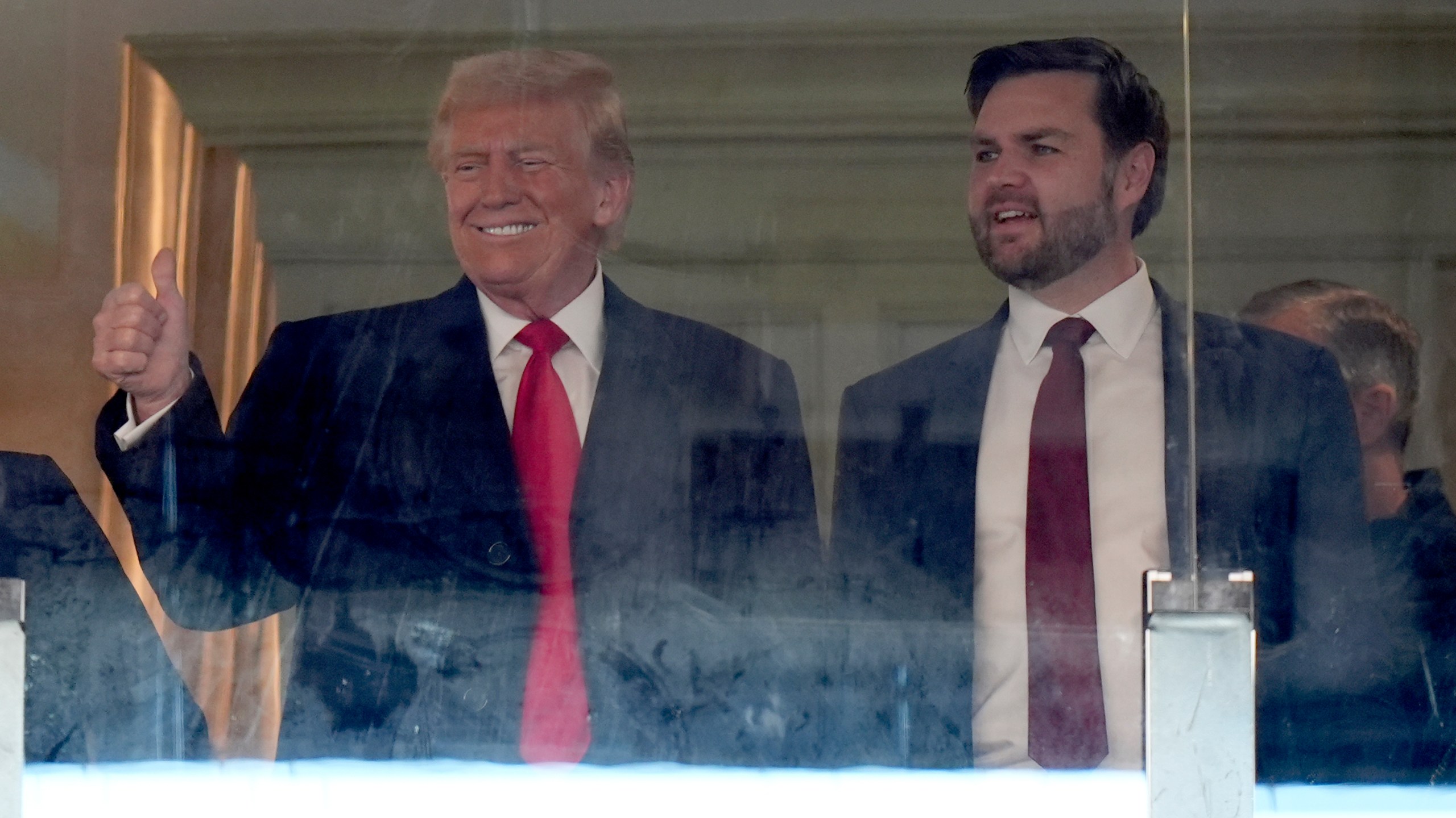 President-elect Donald Trump, left, and Vice President-elect JD Vance attend the NCAA college football game between Army and Navy at Northwest Stadium in Landover, Md., Saturday, Dec. 14, 2024. (AP Photo/Stephanie Scarbrough)