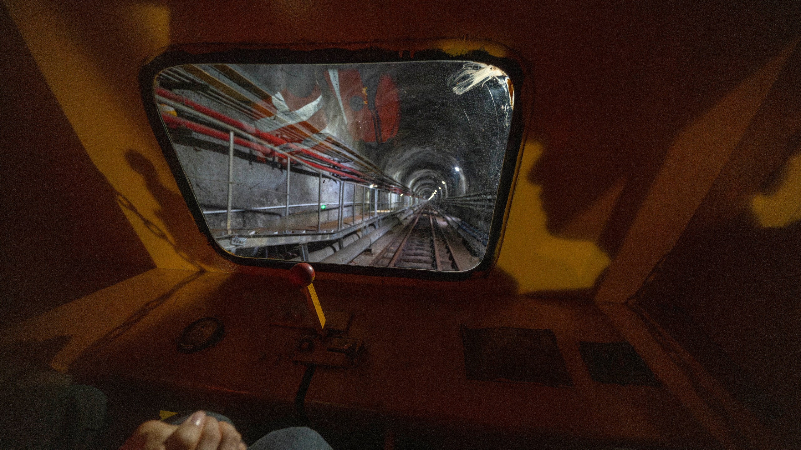 Visitors take a train ride to visit the cosmic detector located 2297 feet (700 meters) underground at the Jiangmen Underground Neutrino Observatory in Kaiping, southern China's Guangdong province on Friday, Oct. 11, 2024. (AP Photo/Ng Han Guan)