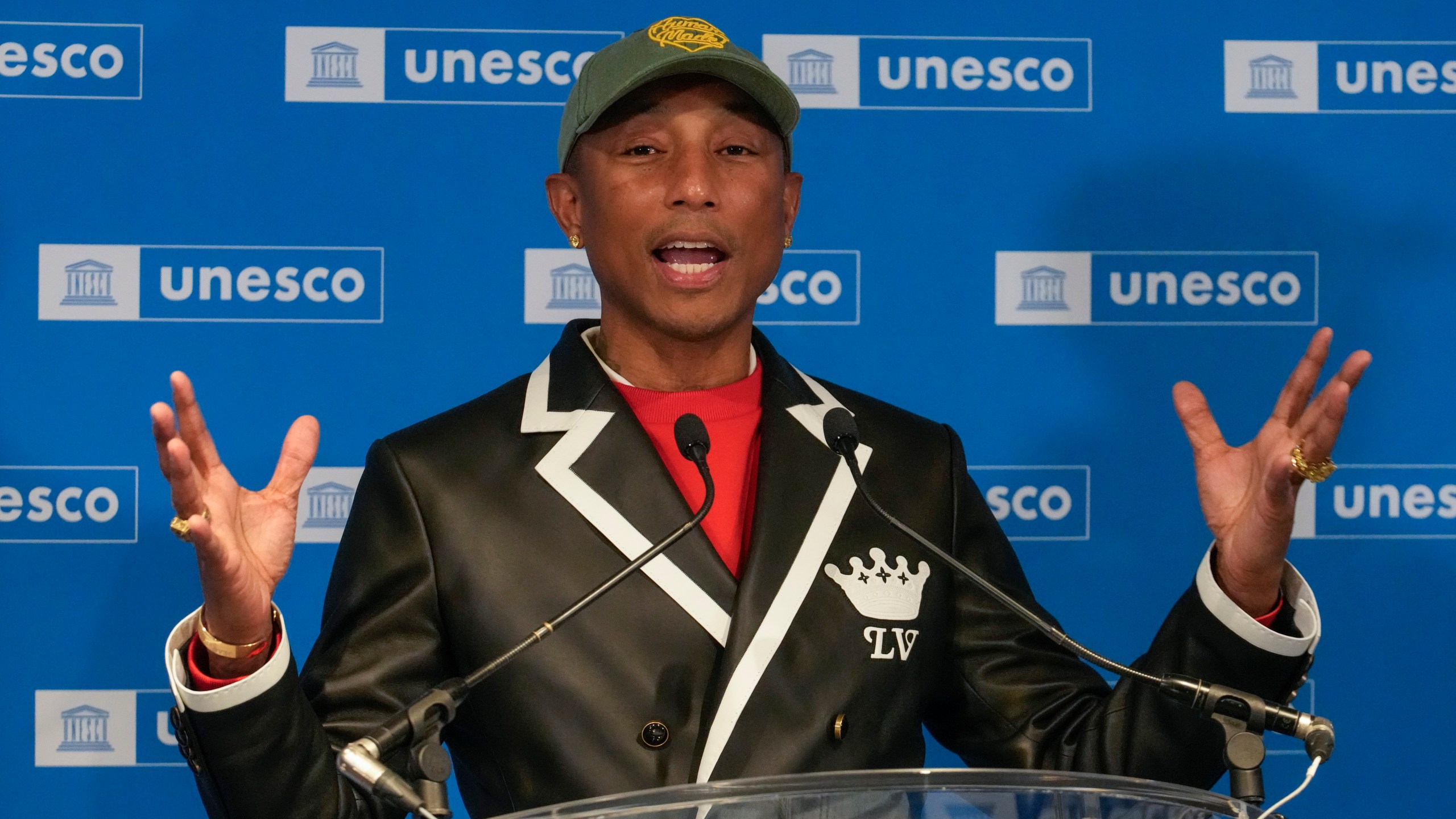 Pharrell Williams gestures as speaks after he was named UNESCO Goodwill Ambassador for for Arts, Education and Entrepreneurship at UNESCO headquarters in Paris, Tuesday, Dec. 17, 2024. (AP Photo/Michel Euler)