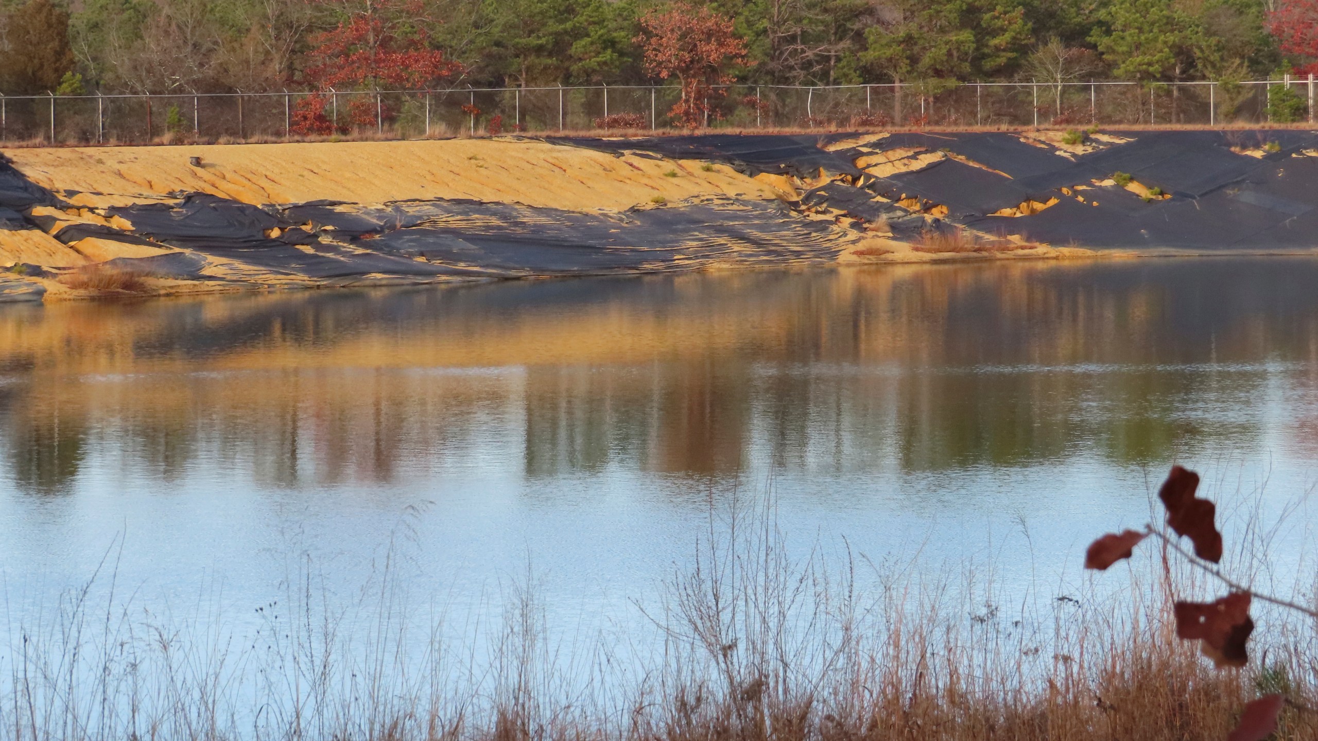 Water sits in a lined pit at the former Ciba-Geigy chemical plant on Dec. 17, 2024, in Toms River, N.J., one of America's most notorious toxic waste sites. (AP Photo/Wayne Parry)