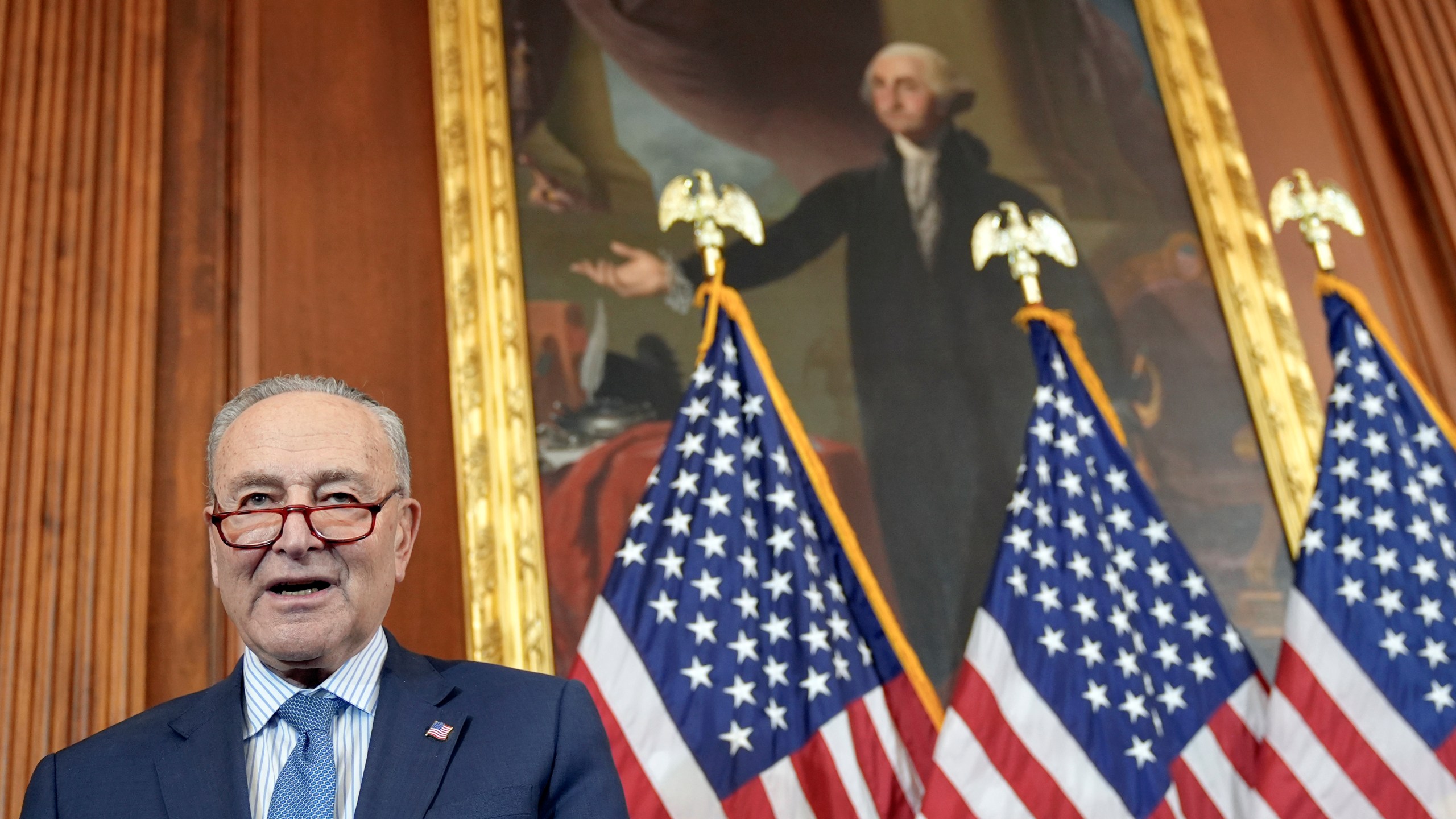 Senate Majority Leader Chuck Schumer, D-N.Y., prays during a U.S. Capitol Hanukkah event with a ceremonial Menorah lighting to commemorate the upcoming eight-day festival of Hanukkah on Capitol Hill Tuesday, Dec. 17, 2024, in Washington. (AP Photo/Mariam Zuhaib)