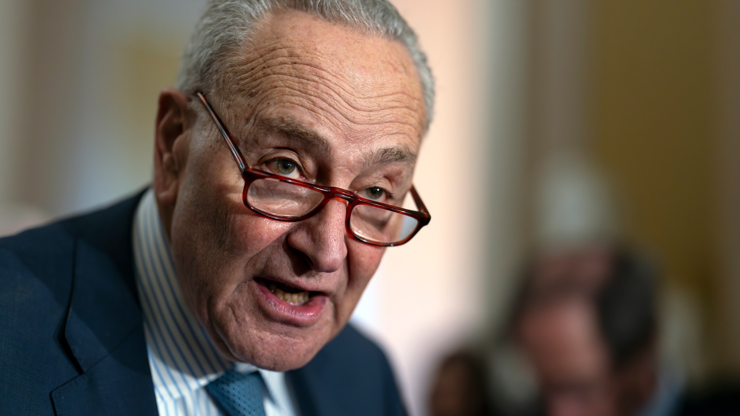 Senate Majority Leader Chuck Schumer, D-N.Y., speaks to reporters following a closed-door strategy session, at the Capitol in Washington, Tuesday, Dec. 17, 2024. Congressional leaders are nearing the unveiling of an agreement that will keep the federal government funded through March 14 and provide more than $100 billion in emergency aid to help states and local communities recover from Hurricanes Helene and Milton, and other natural disasters. (AP Photo/J. Scott Applewhite)