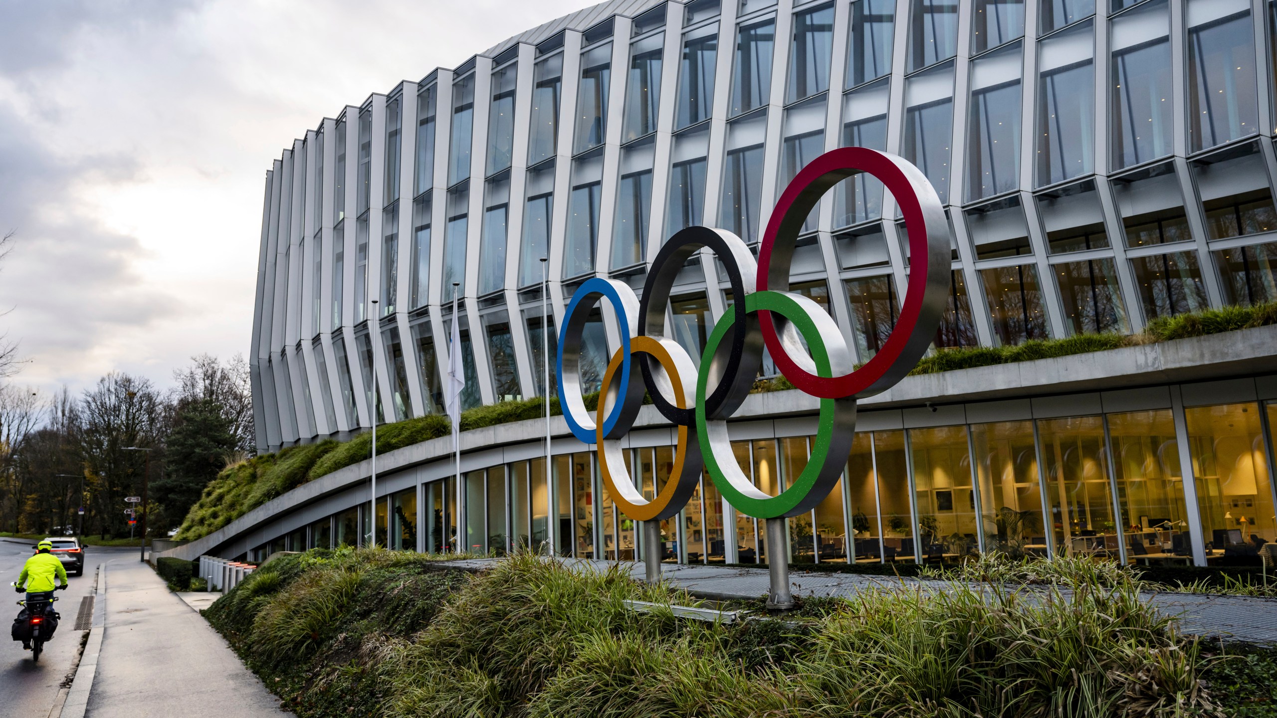 The Olympic rings are pictured front of the Olympic House before the opening of the executive board meeting of the IOC, in Lausanne, Switzerland, Tuesday, Dec. 3, 2024. (Jean-Christophe Bott/Keystone via AP)