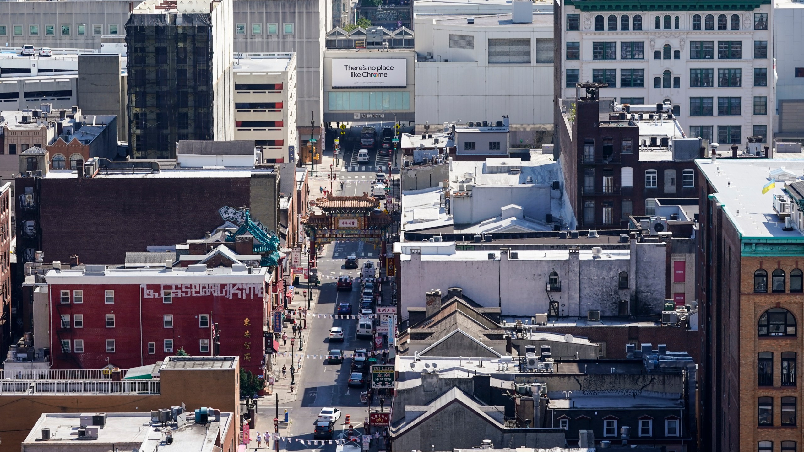 FILE - The Fashion District shopping center, top right, the proposed location of a new Philadelphia 76ers NBA basketball arena, stands near the Chinatown neighborhood in Philadelphia, July 22, 2022. (AP Photo/Matt Rourke, File)