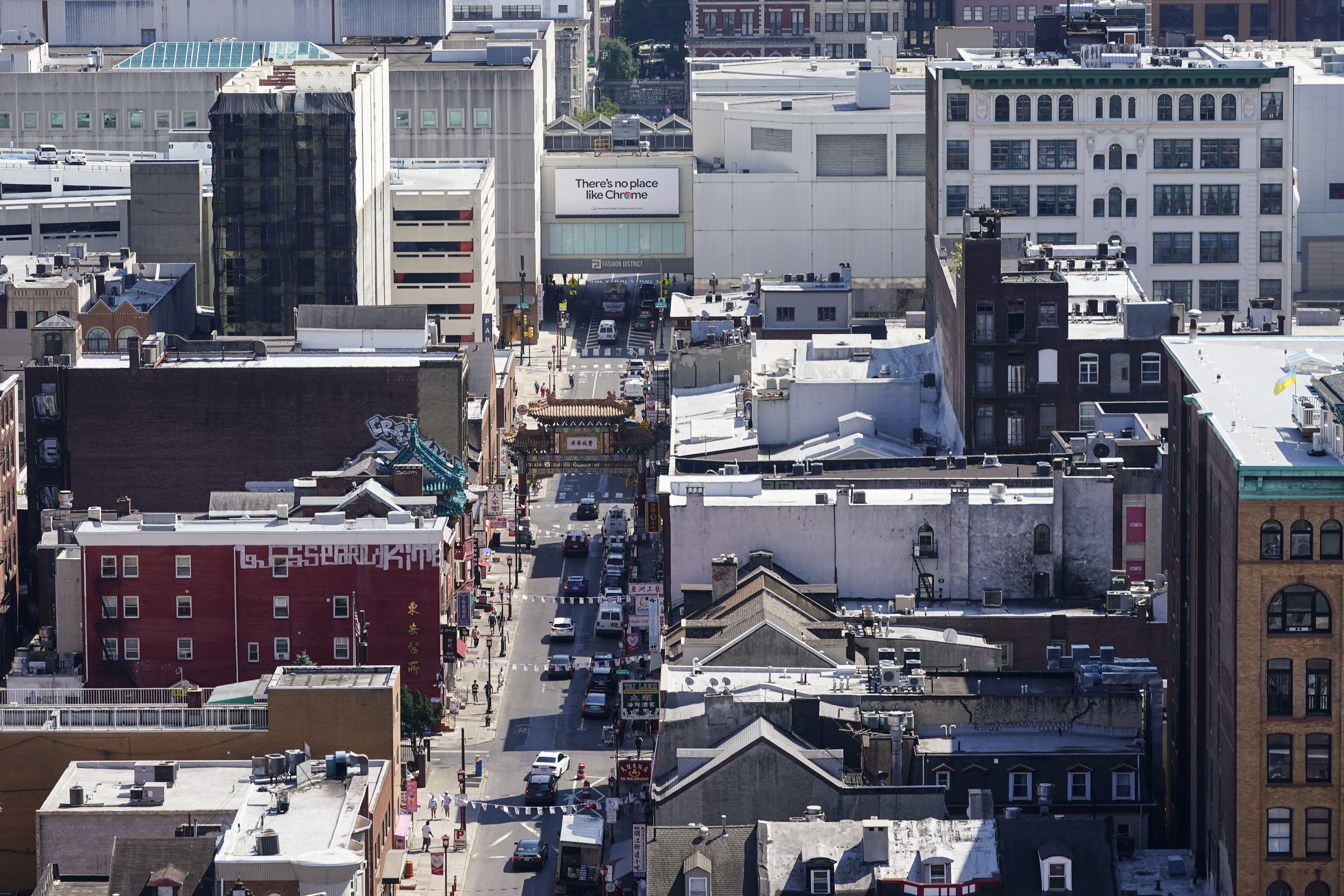 FILE - The Fashion District shopping center, top right, the proposed location of a new Philadelphia 76ers NBA basketball arena, stands near the Chinatown neighborhood in Philadelphia, July 22, 2022. (AP Photo/Matt Rourke, File)