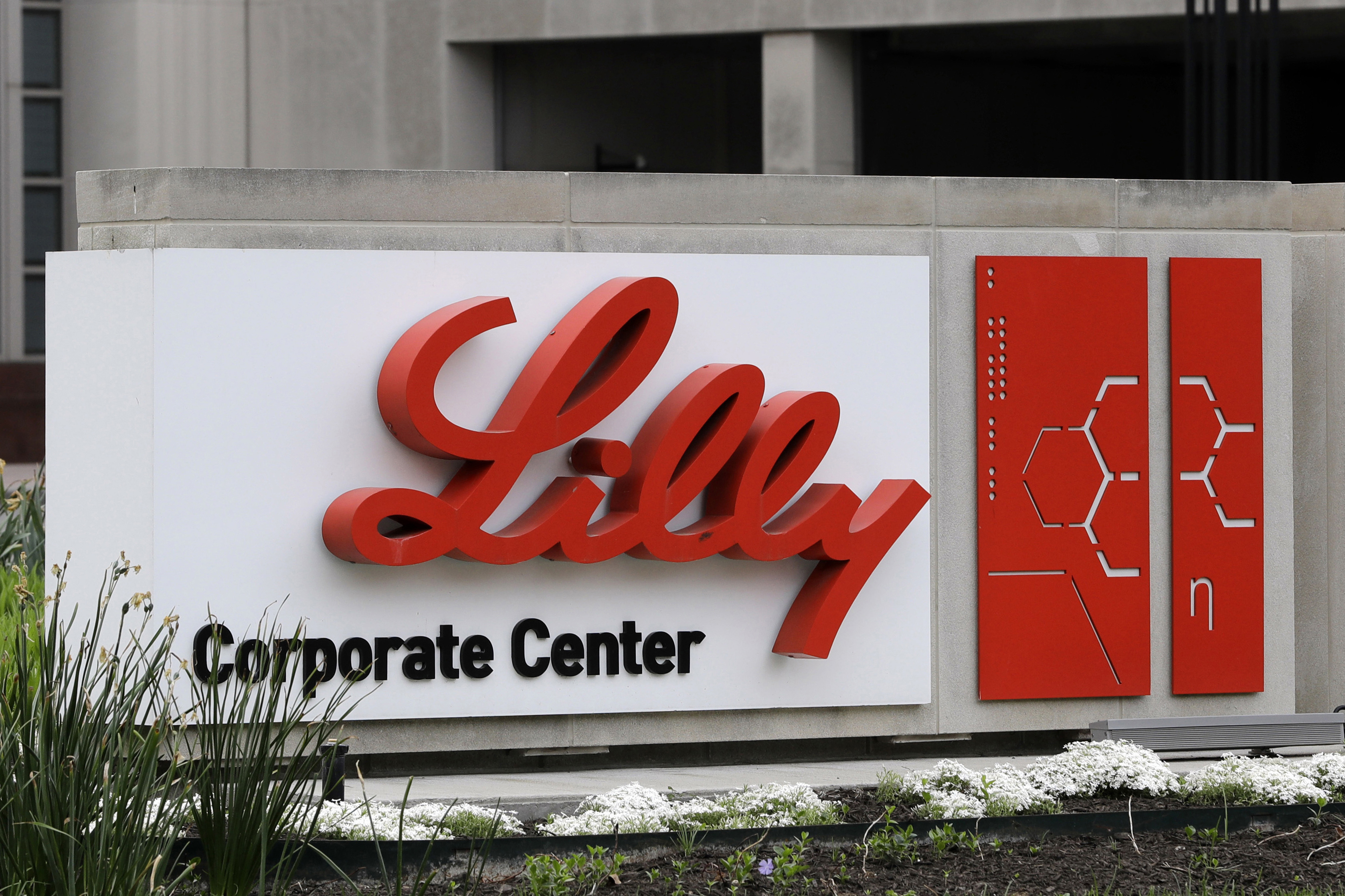 FILE - A sign for Eli Lilly & Co. stands outside their corporate headquarters in Indianapolis on April 26, 2017. (AP Photo/Darron Cummings, File)