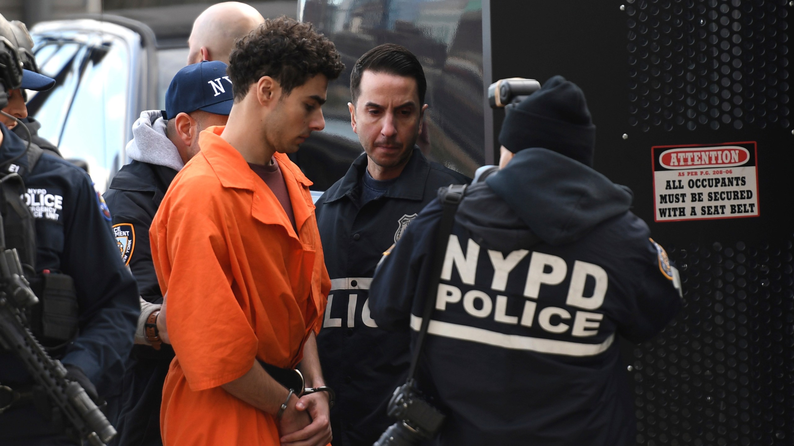 Luigi Mangione, a suspect in the fatal shooting of UnitedHealthcare CEO Brian Thompson, is escorted by police, Thursday, Dec. 19, 2024, in New York. (AP Photo/Pamela Smith)