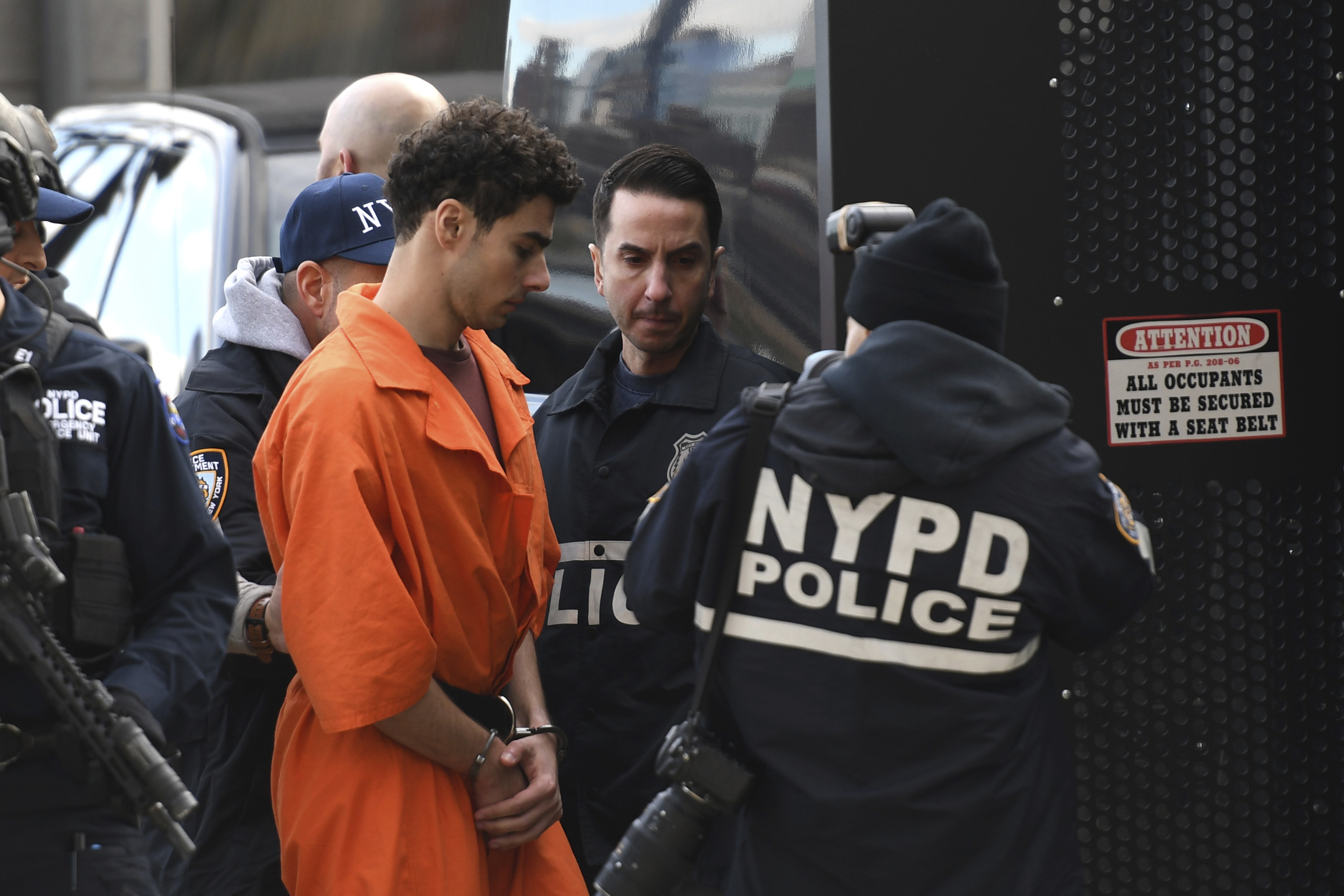 Luigi Mangione, a suspect in the fatal shooting of UnitedHealthcare CEO Brian Thompson, is escorted by police, Thursday, Dec. 19, 2024, in New York. (AP Photo/Pamela Smith)