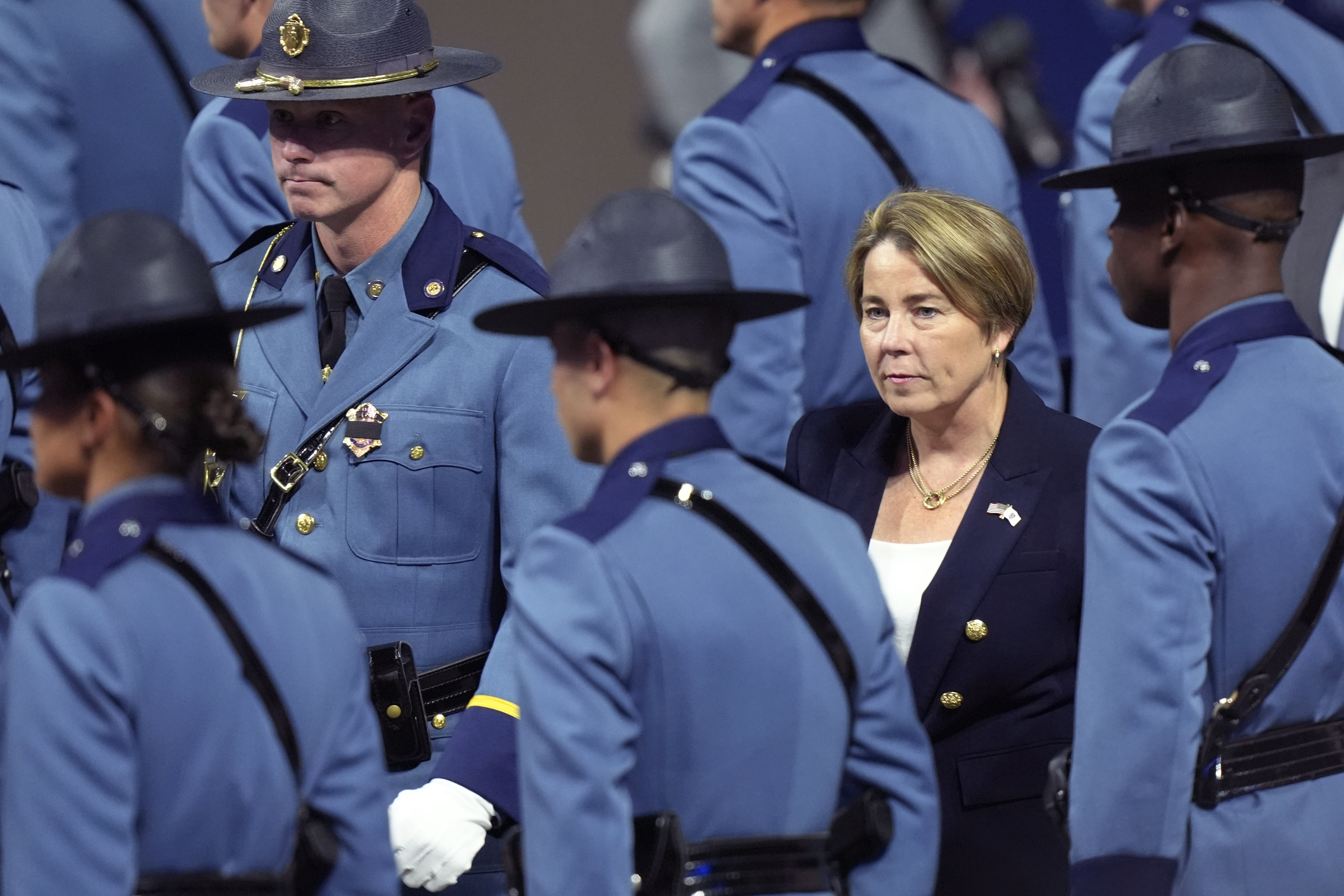 FILE - Massachusetts Gov. Maura Healey, right, walks among members of the 90th Recruit Training Group of the Massachusetts State Police, during a swearing in ceremony in Worcester, Mass., Oct. 9, 2024. (AP Photo/Steven Senne, File)