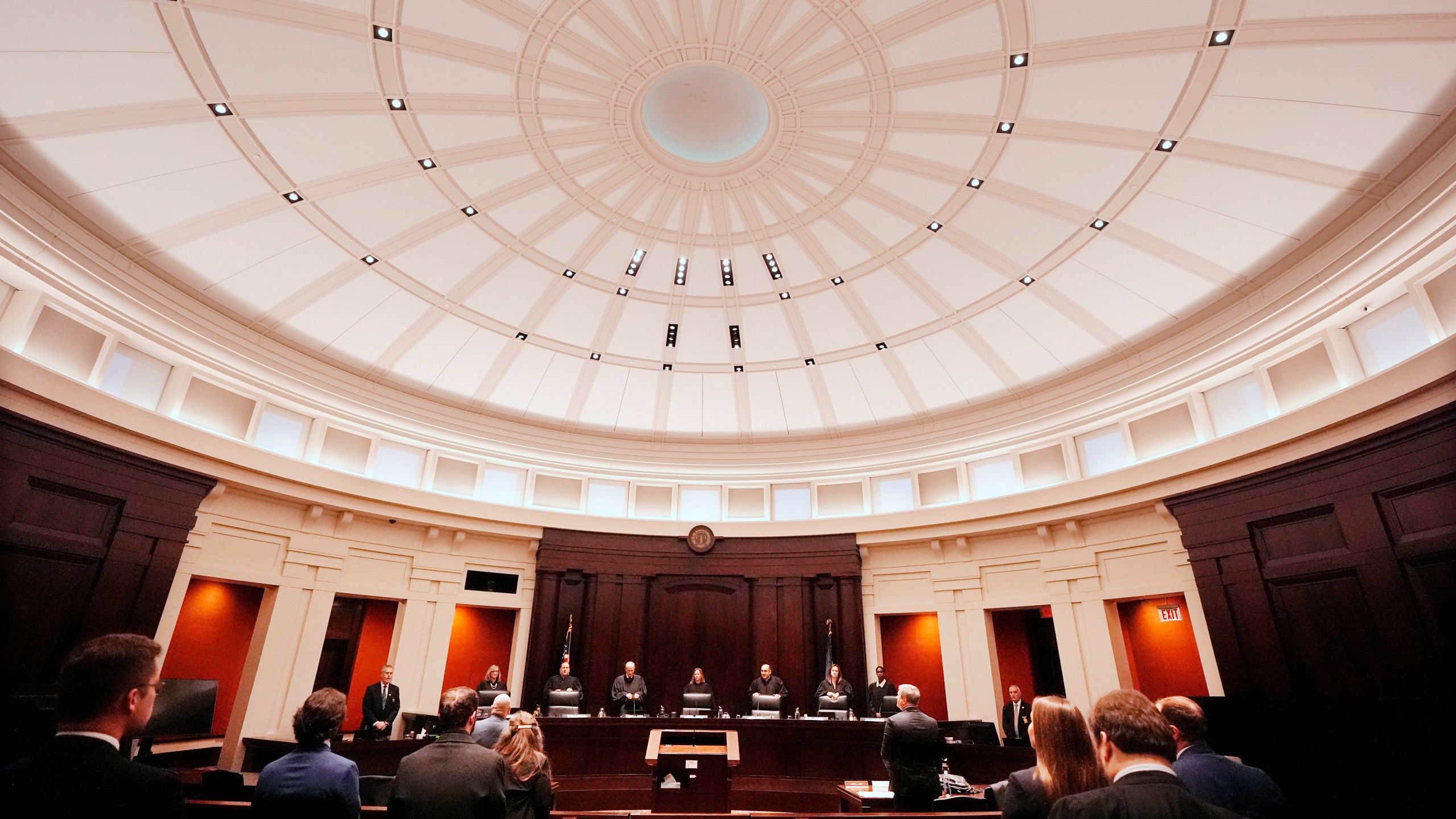 Justices of the Michigan Supreme Court enter their court at the Michigan Hall of Justice, Wednesday, Dec. 4, 2024, in Lansing, Mich. (AP Photo/Carlos Osorio)