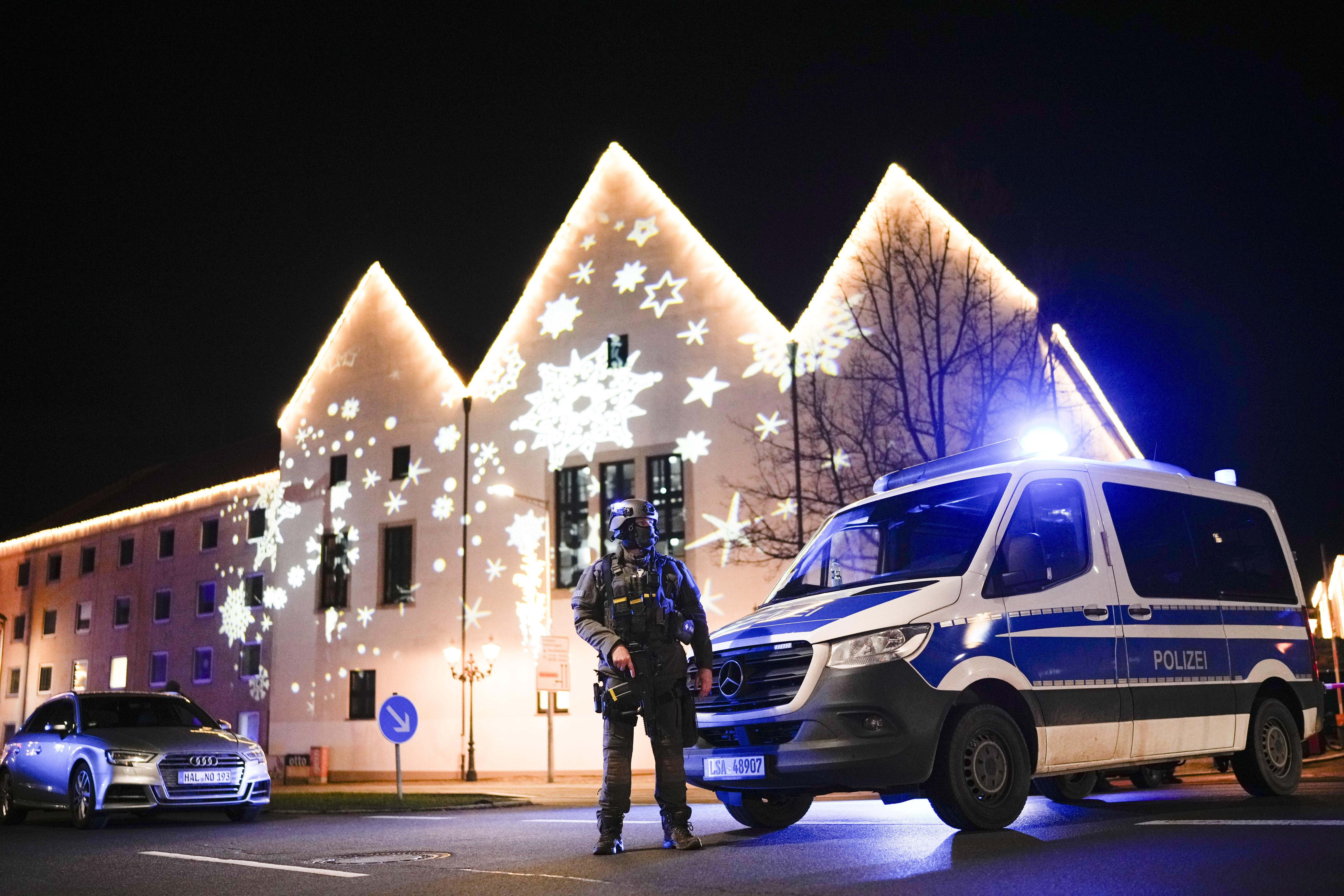 A police officer guards at a blocked road near a Christmas market after an incident in Magdeburg, Germany, Friday, Dec. 20, 2024. (AP Photo/Ebrahim Noroozi)