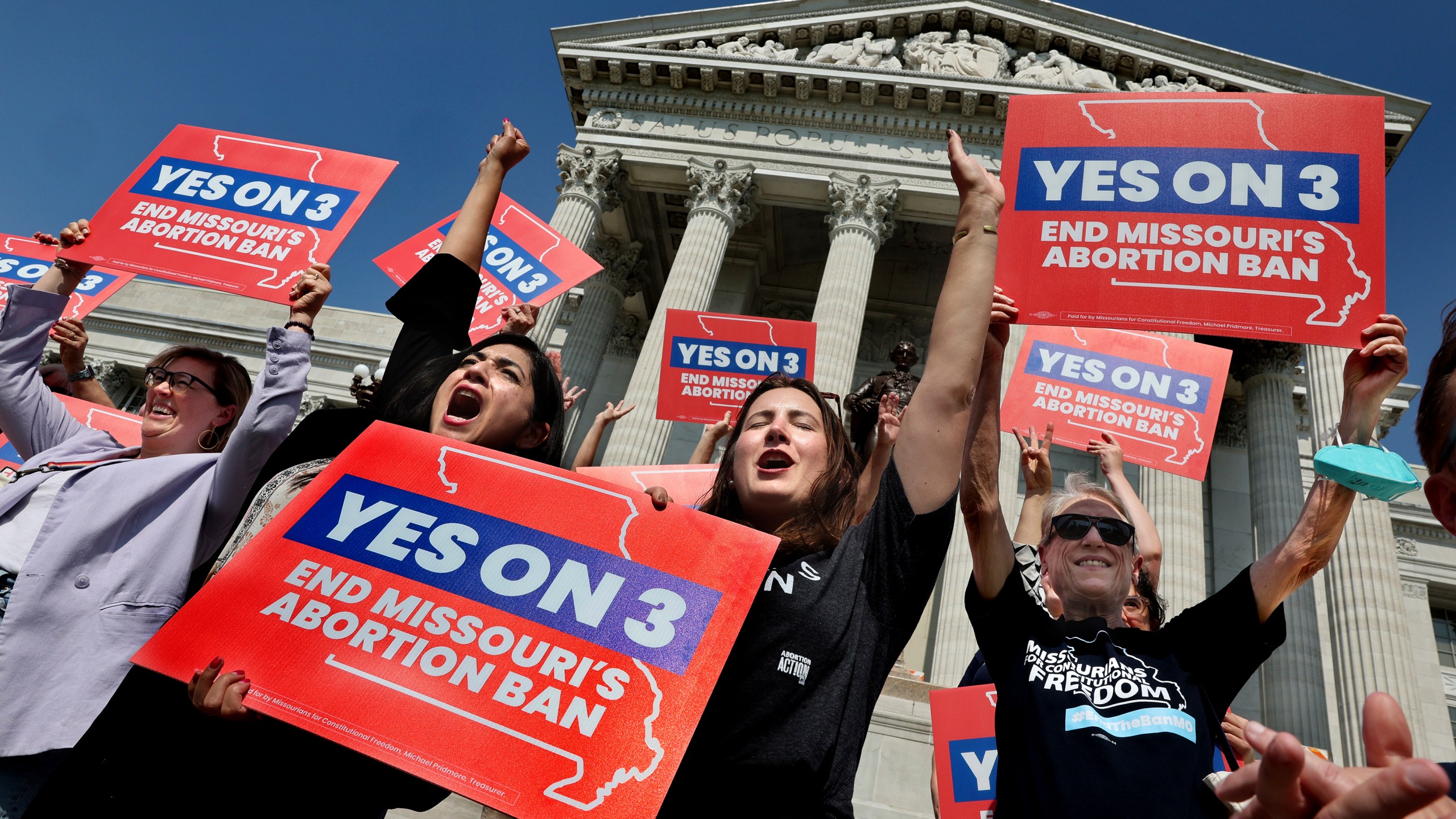 FILE - Amendment 3 supporters Luz Maria Henriquez, second from left, executive director of the ACLU Missouri, celebrates with Mallory Schwarz, center, of Abortion Action Missouri, after the Missouri Supreme Court in Jefferson City, Mo., ruled that the amendment to protect abortion rights would stay on the November ballot. Abortion-rights advocates will ask a judge Wednesday, Dec. 4, 2024 to overturn Missouri’s near-total ban on the procedure, less than a month after voters backed an abortion-rights constitutional amendment. (Robert Cohen/St. Louis Post-Dispatch via AP, File)