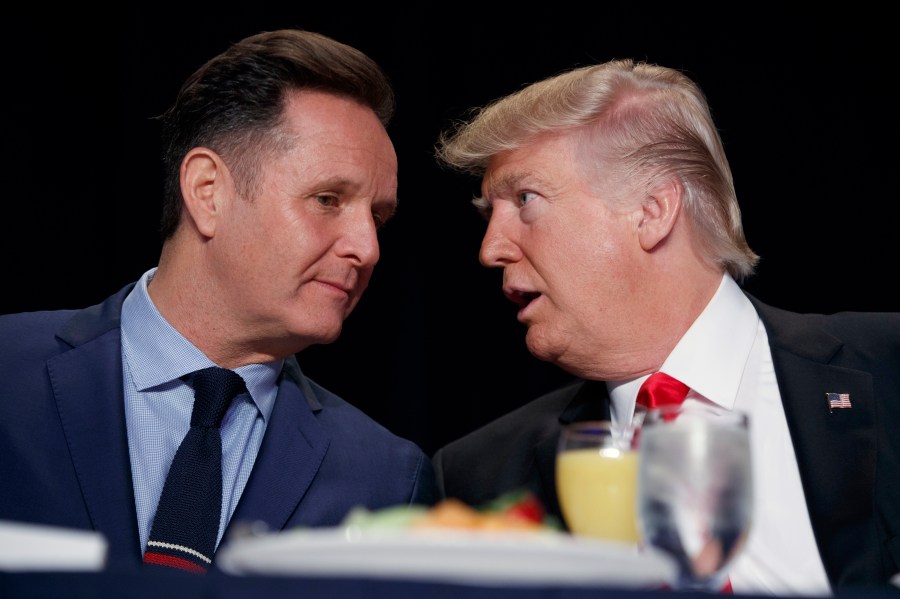 FILE - President Donald Trump, right, talks with television producer Mark Burnett during the National Prayer Breakfast, Feb. 2, 2017, in Washington. (AP Photo/Evan Vucci, File)