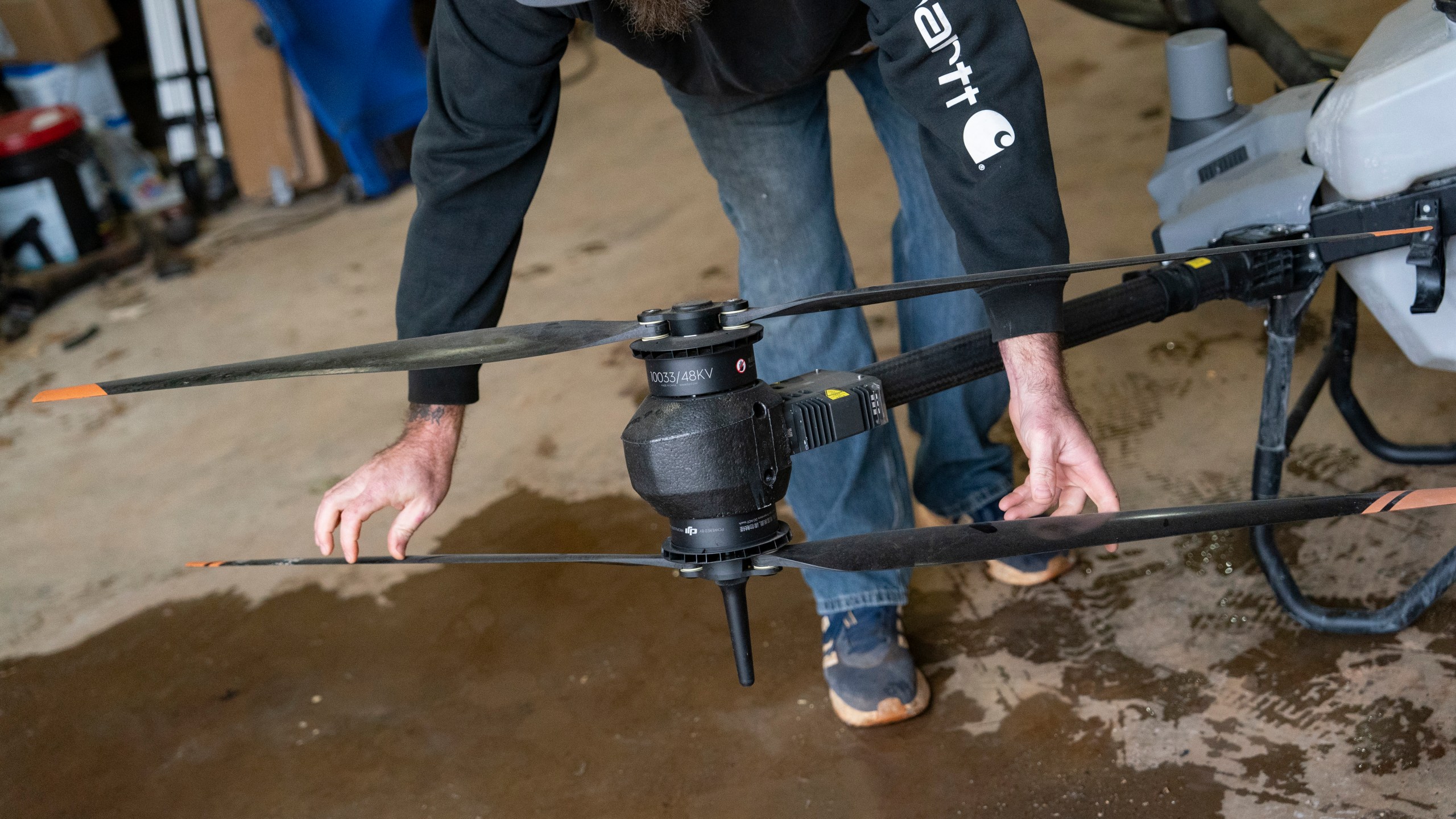 Russell Hedrick prepares a DJI drone to put crop cover on his farm, Tuesday, Dec. 17, 2024, in Hickory, N.C. (AP Photo/Allison Joyce)