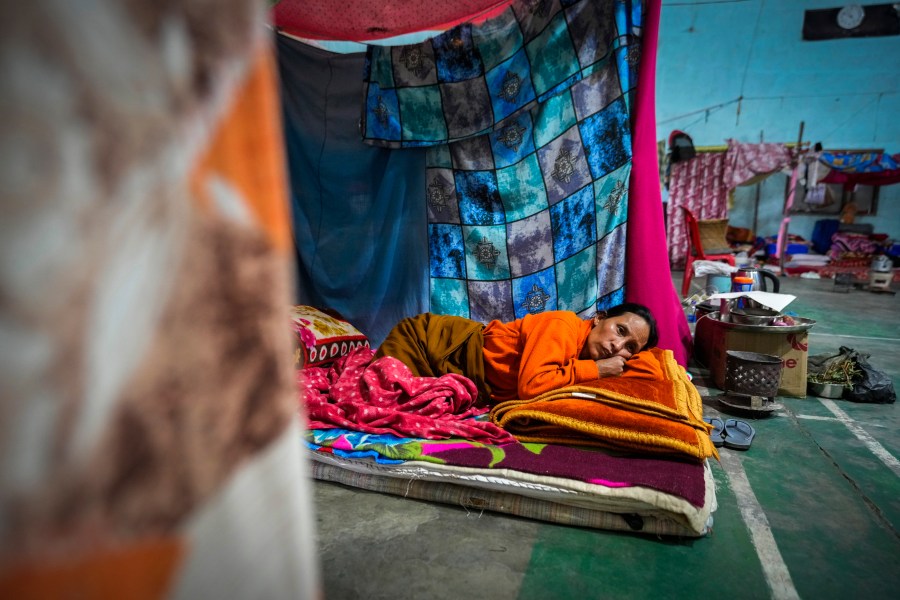 A Meitei woman rests in a relief camp in Imphal, Manipur, Monday, Dec. 16, 2024. (AP Photo/Anupam Nath)