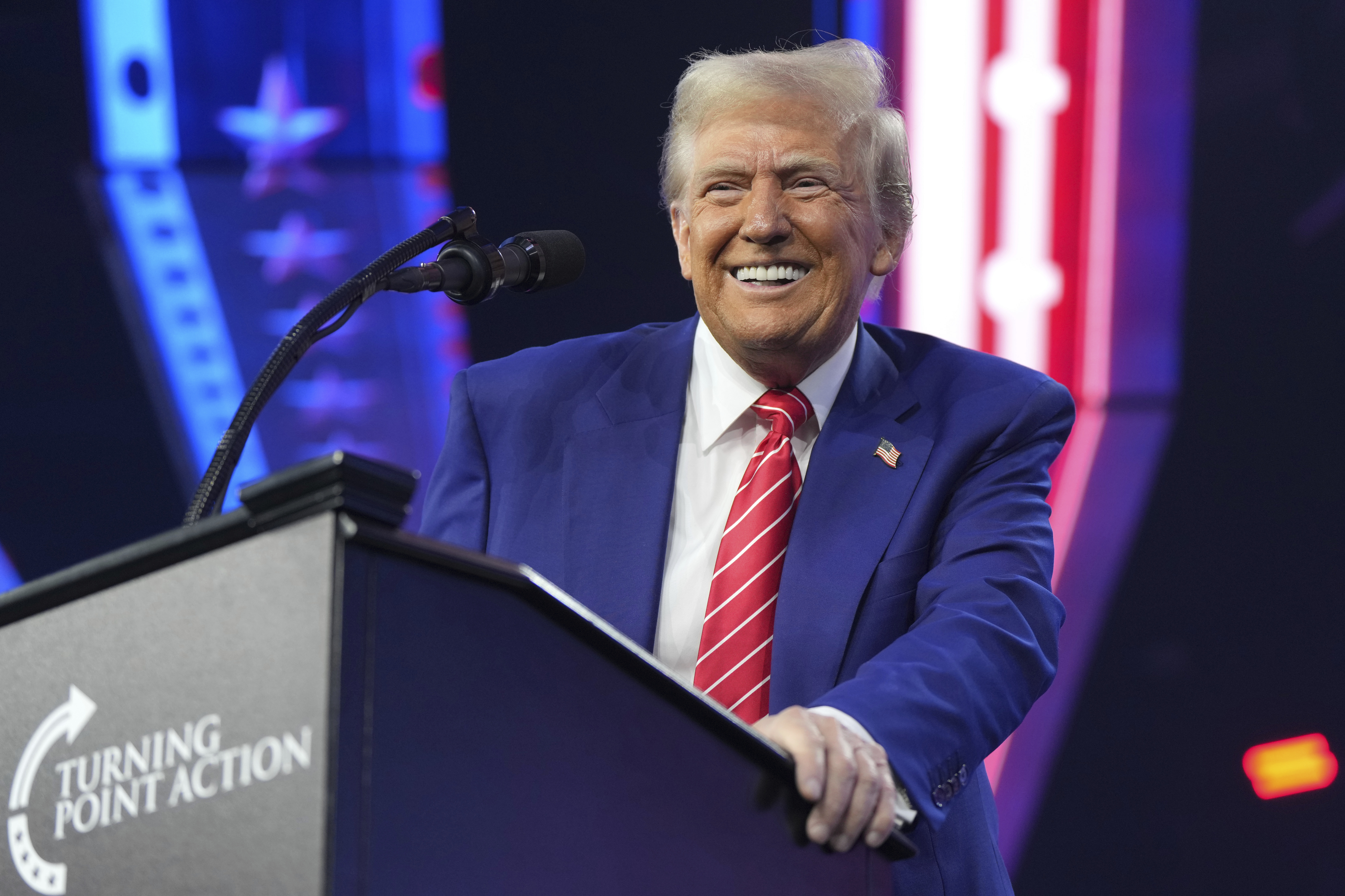 President-elect Donald Trump speaks at AmericaFest, Sunday, Dec. 22, 2024, in Phoenix. (AP Photo/Rick Scuteri)