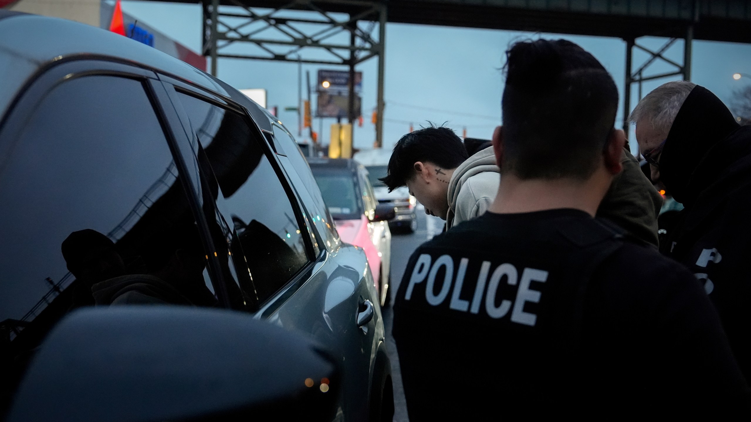 Deportation officers with Enforcement and Removal Operations in U.S. Immigration and Customs Enforcement's New York City field office arrest Wilmer Patricio Medina-Medina during an early morning operation, Tuesday, Dec. 17, 2024, in the Bronx borough of New York. (AP Photo/Julia Demaree Nikhinson)