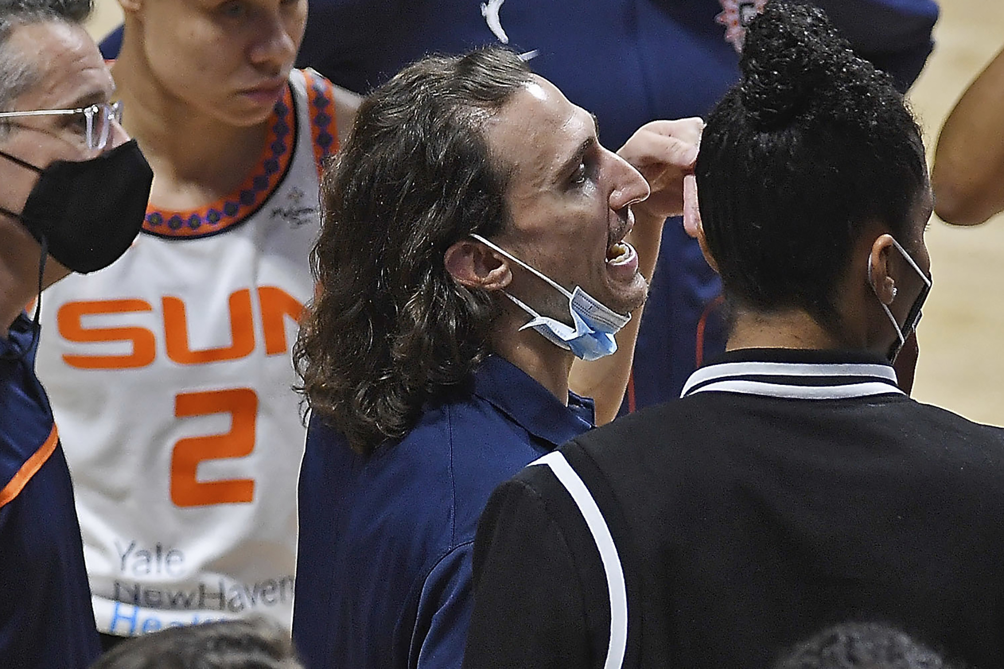 Connecticut Sun's Chris Koclanes talk with players during a timeout in the team's WNBA basketball game against the Washington Mystics on Friday, May 28, 2021, in Uncasville, Conn. (Sean D. Elliot/The Day via AP)