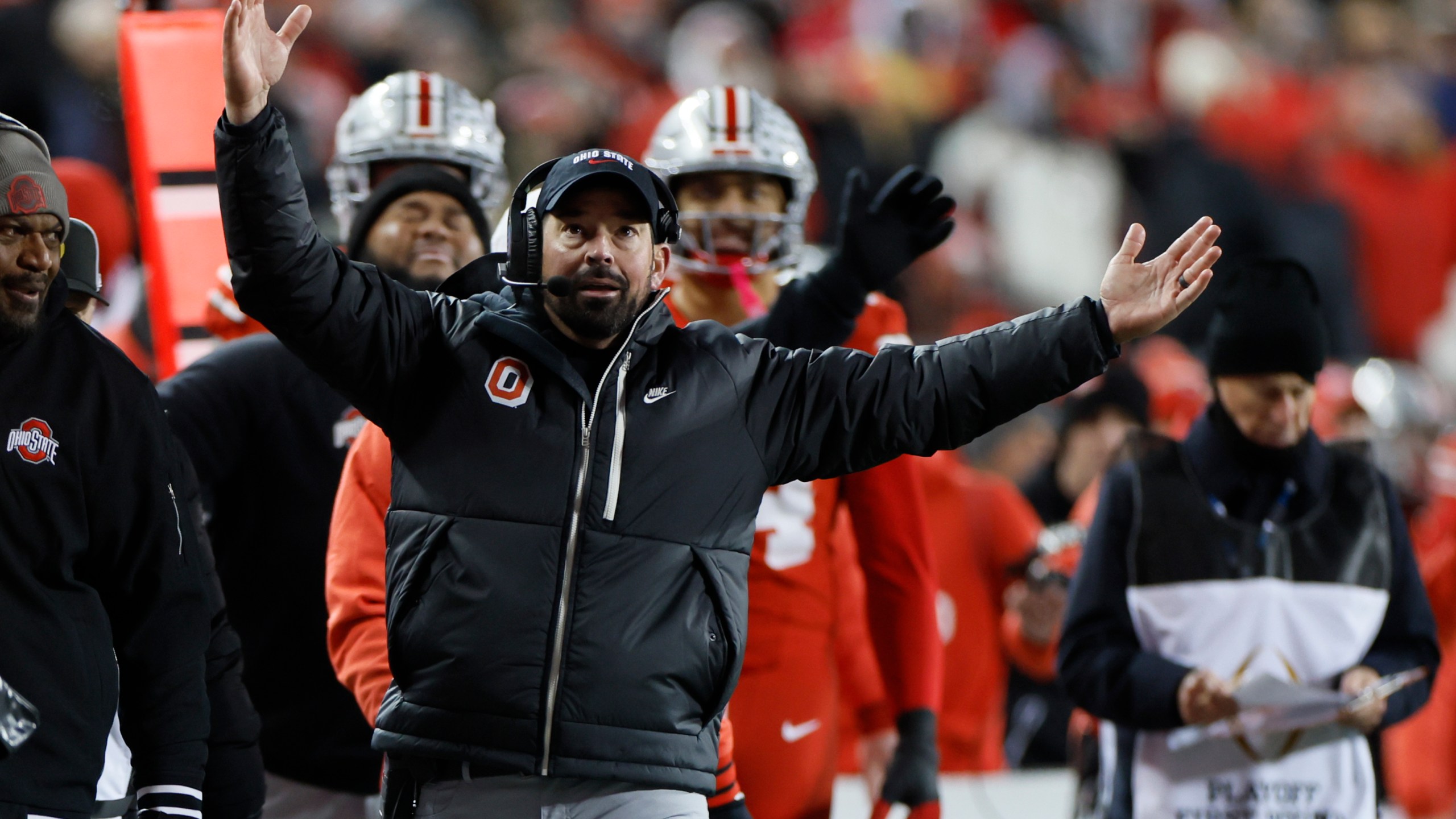 Ohio State head coach Ryan Day, front, reacts to the video replay during the first half in the first round of the College Football Playoff against Tennessee, Saturday, Dec. 21, 2024, in Columbus, Ohio. (AP Photo/Jay LaPrete)