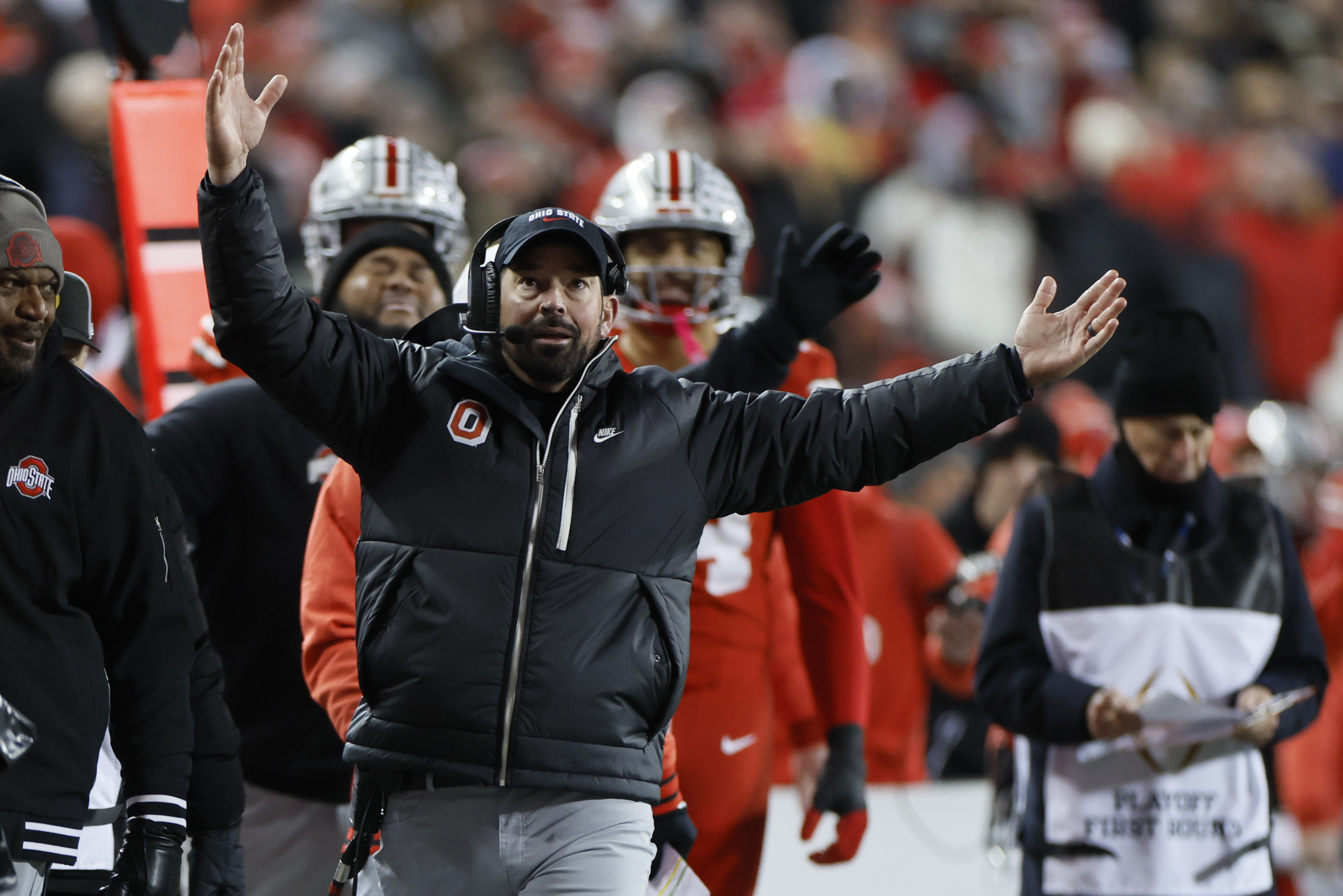 Ohio State head coach Ryan Day, front, reacts to the video replay during the first half in the first round of the College Football Playoff against Tennessee, Saturday, Dec. 21, 2024, in Columbus, Ohio. (AP Photo/Jay LaPrete)