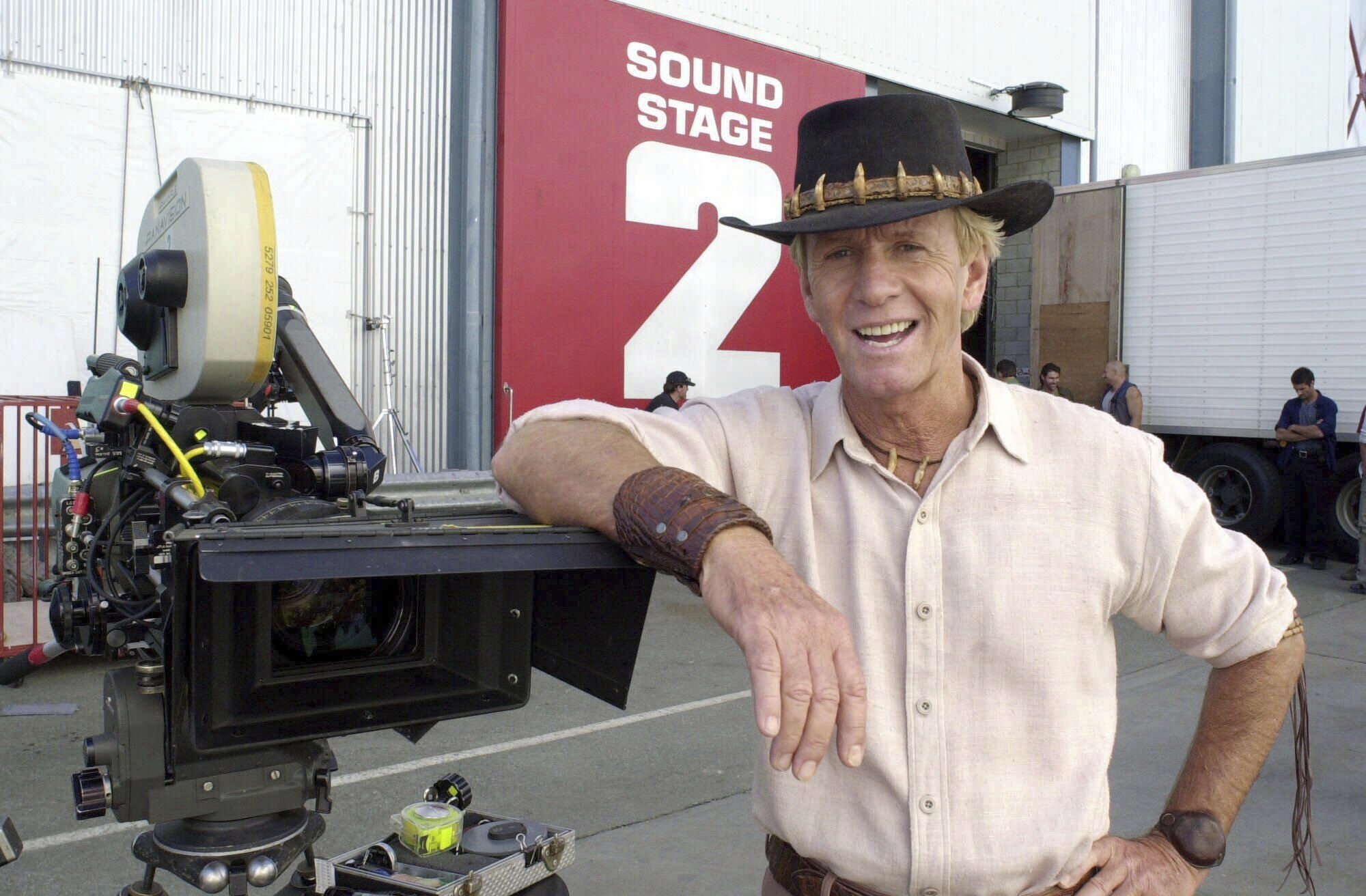 FILE - Actor Paul Hogan stands on the set of "Crocodile Dundee in Los Angeles" on the Gold Coast, Australia Tuesday Aug. 29, 2000. (AP Photo/Steve Holland, File)