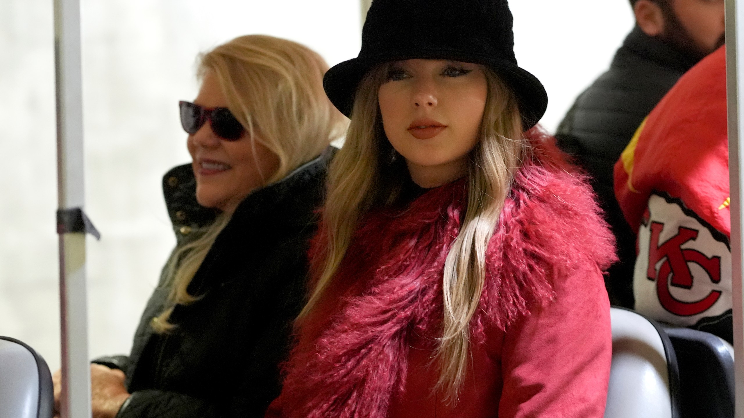 Taylor Swift arrives with her mother, Andrea Swift, before an NFL football game between the Kansas City Chiefs and the Houston Texans Saturday, Dec. 21, 2024, in Kansas City, Mo. (AP Photo/Ed Zurga)