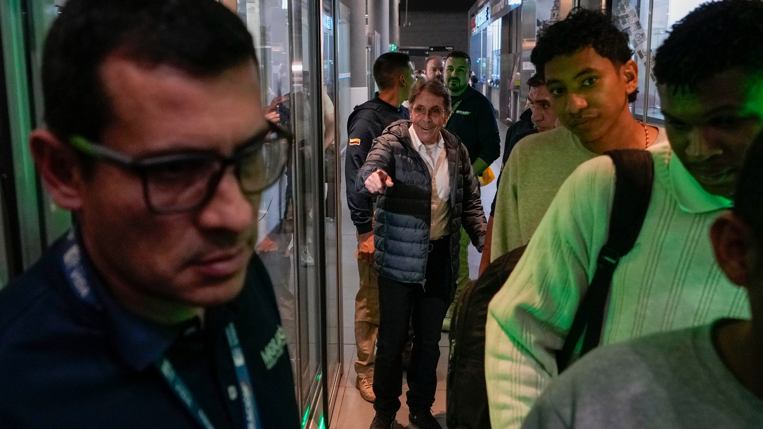 Fabio Ochoa, center, a former member of Cartel of Medellin, arrives at El Dorado airport after being deported from the U.S., in Bogota, Colombia, Monday, Dec. 23, 2024. (AP Photo/Fernando Vergara)