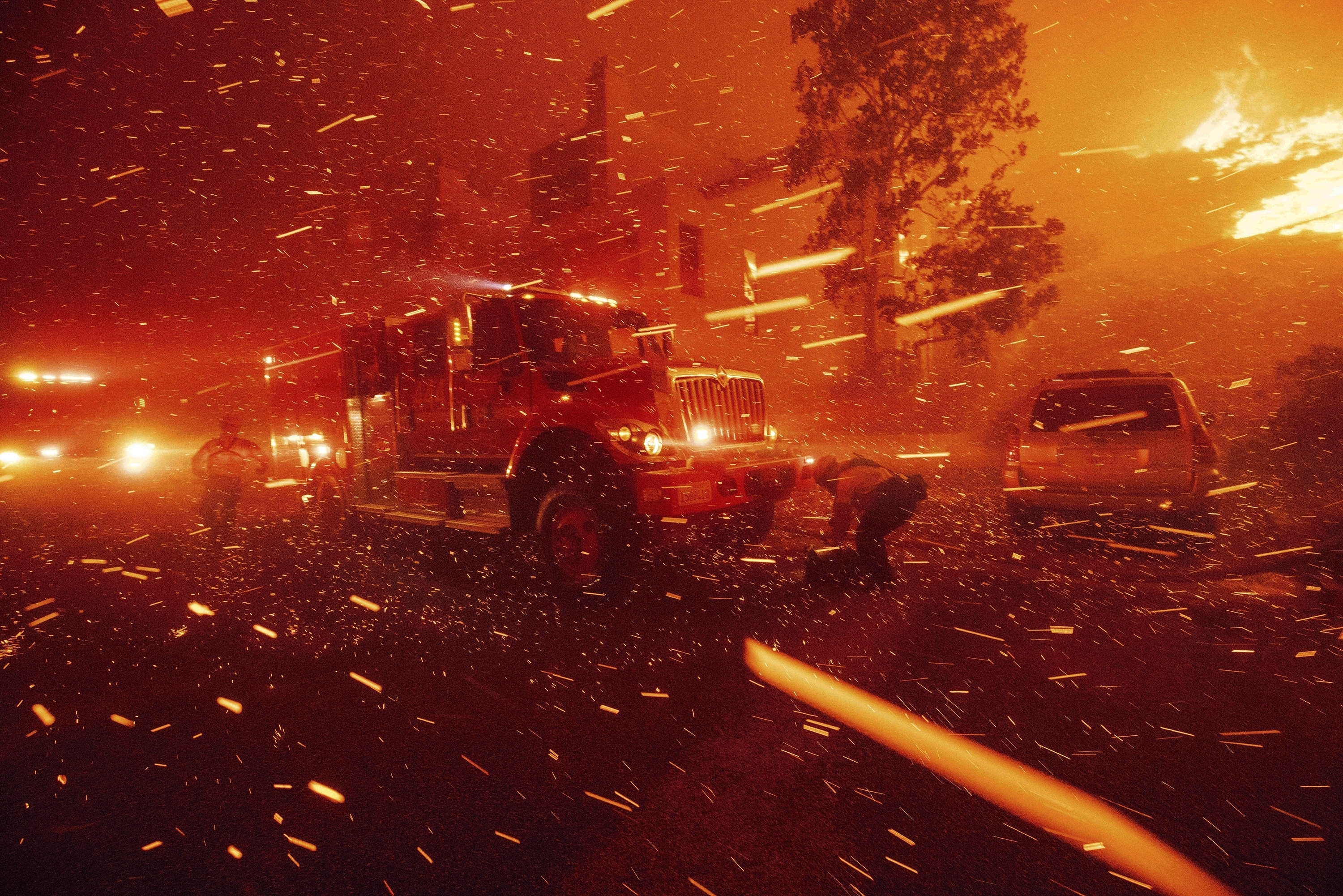 FILE - Firefighters battle the Franklin Fire in Malibu, Calif., Dec. 10, 2024. (AP Photo/Ethan Swope)