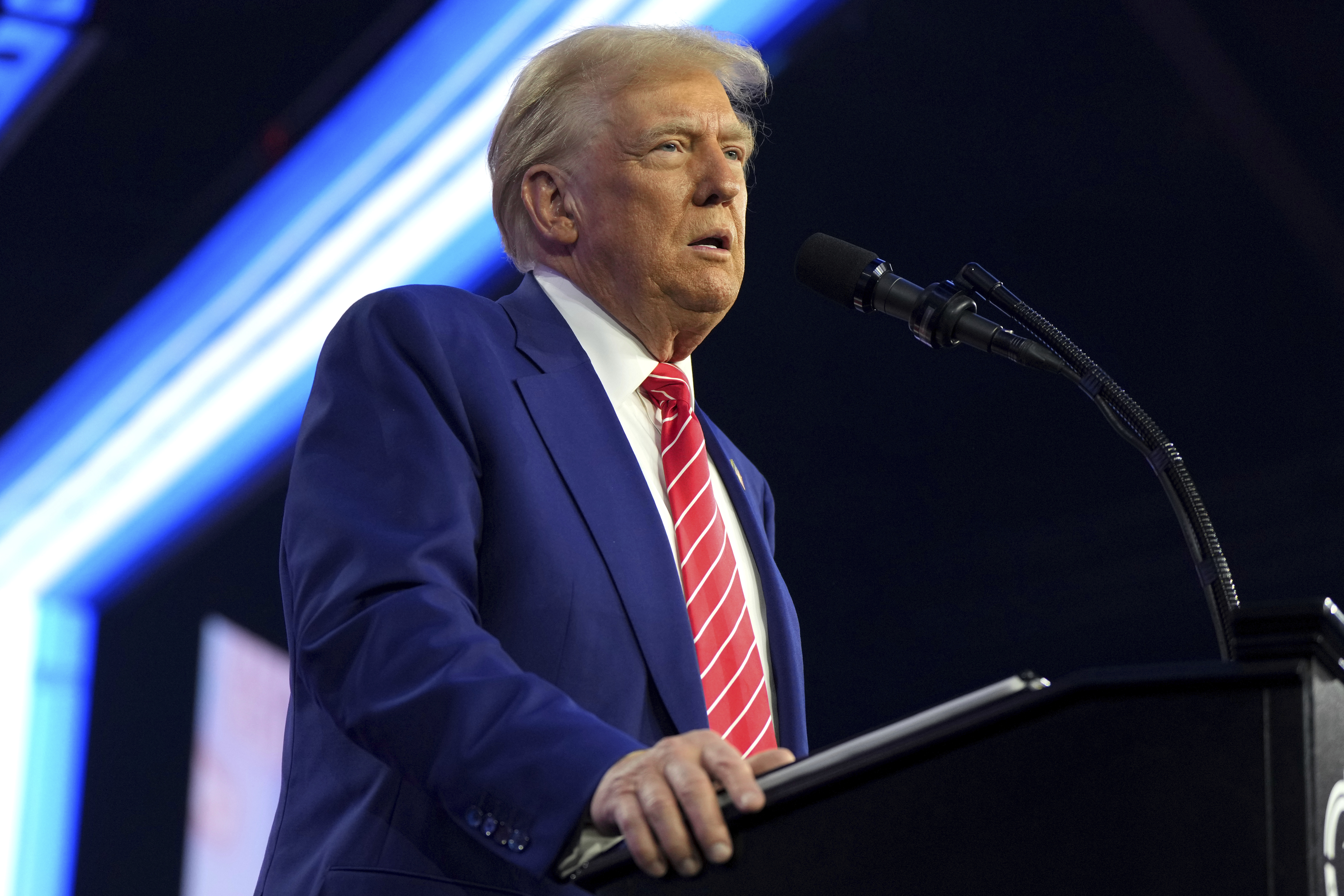 President-elect Donald Trump speaks at AmericaFest, Sunday, Dec. 22, 2024, in Phoenix. (AP Photo/Rick Scuteri)