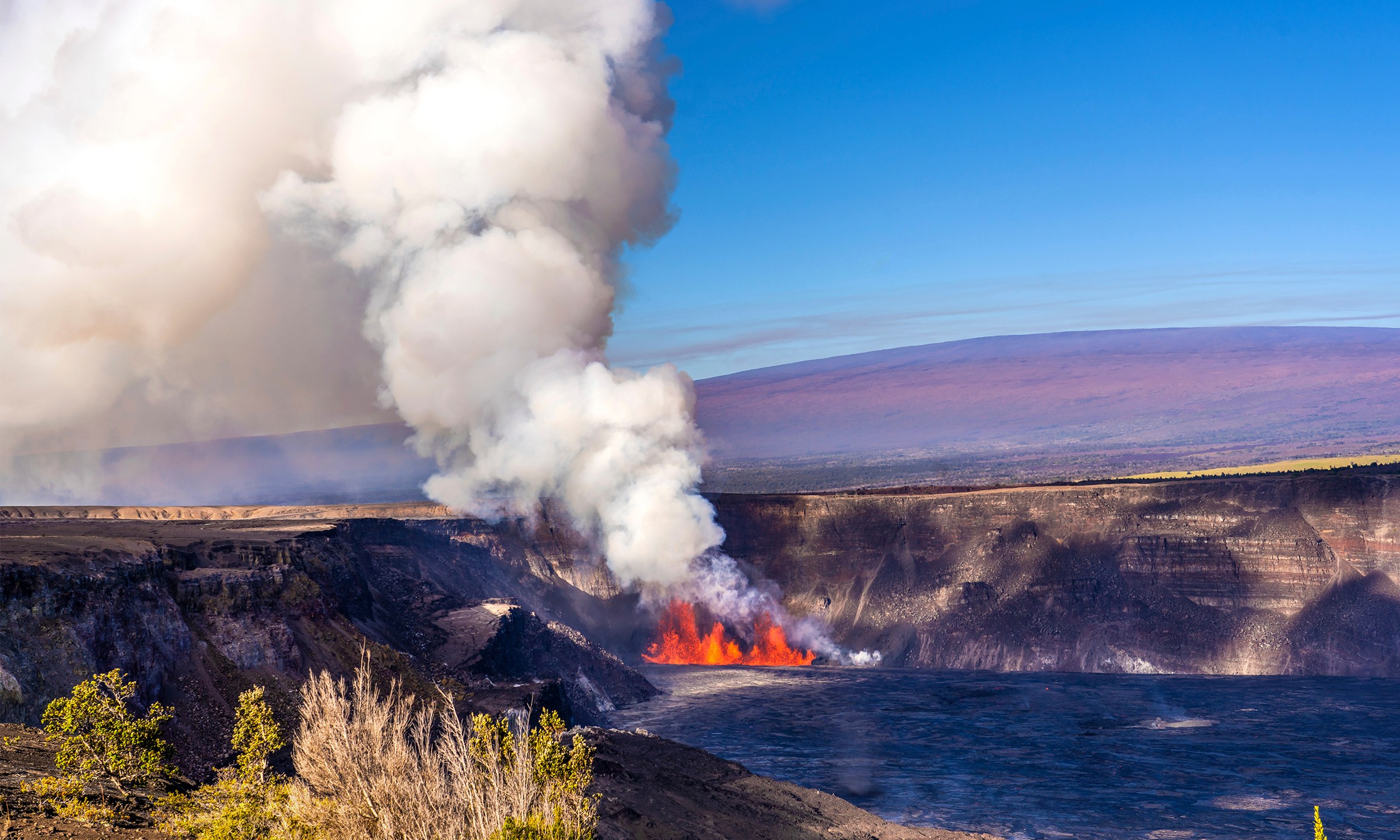 In this photo provided by the National Park Service, an eruption takes place on the summit of the Kilauea volcano in Hawaii, Monday, Dec. 23, 2024. (Janice Wei/NPS via AP)