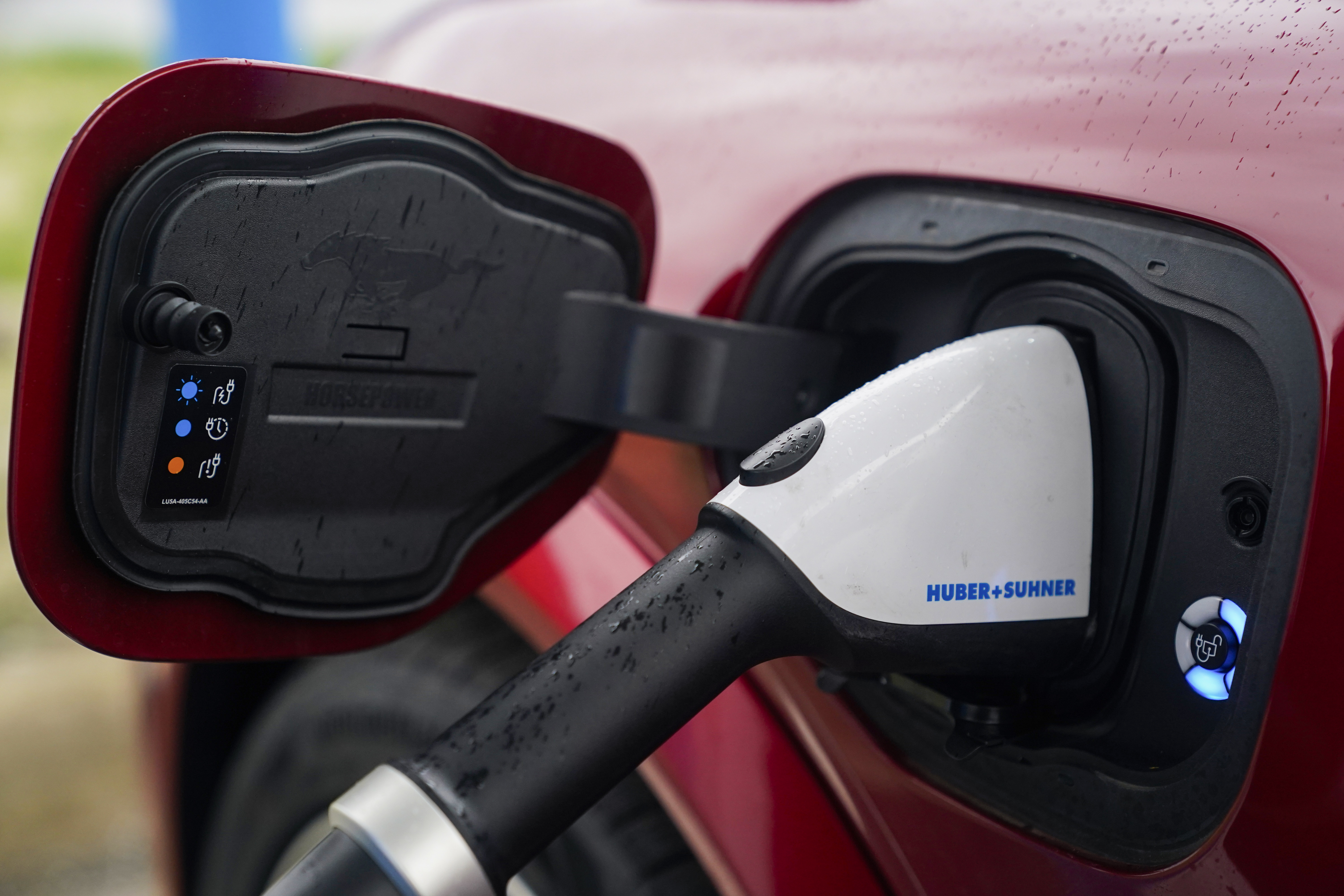 FILE - A 2023 Ford Mustang Mach-E charges, March 8, 2024, at an electric vehicle charging station in London, Ohio. (AP Photo/Joshua A. Bickel, File)